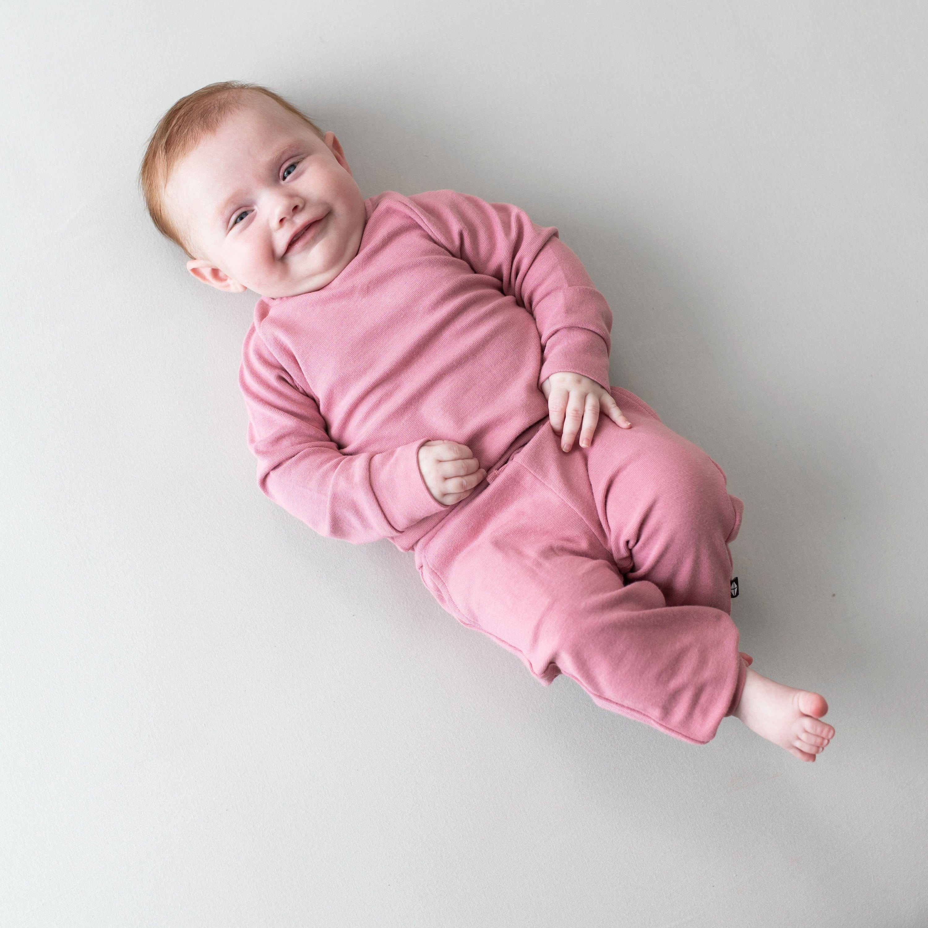 Infant wearing Bamboo Jersey baby Jogger Set in Apple Blossom