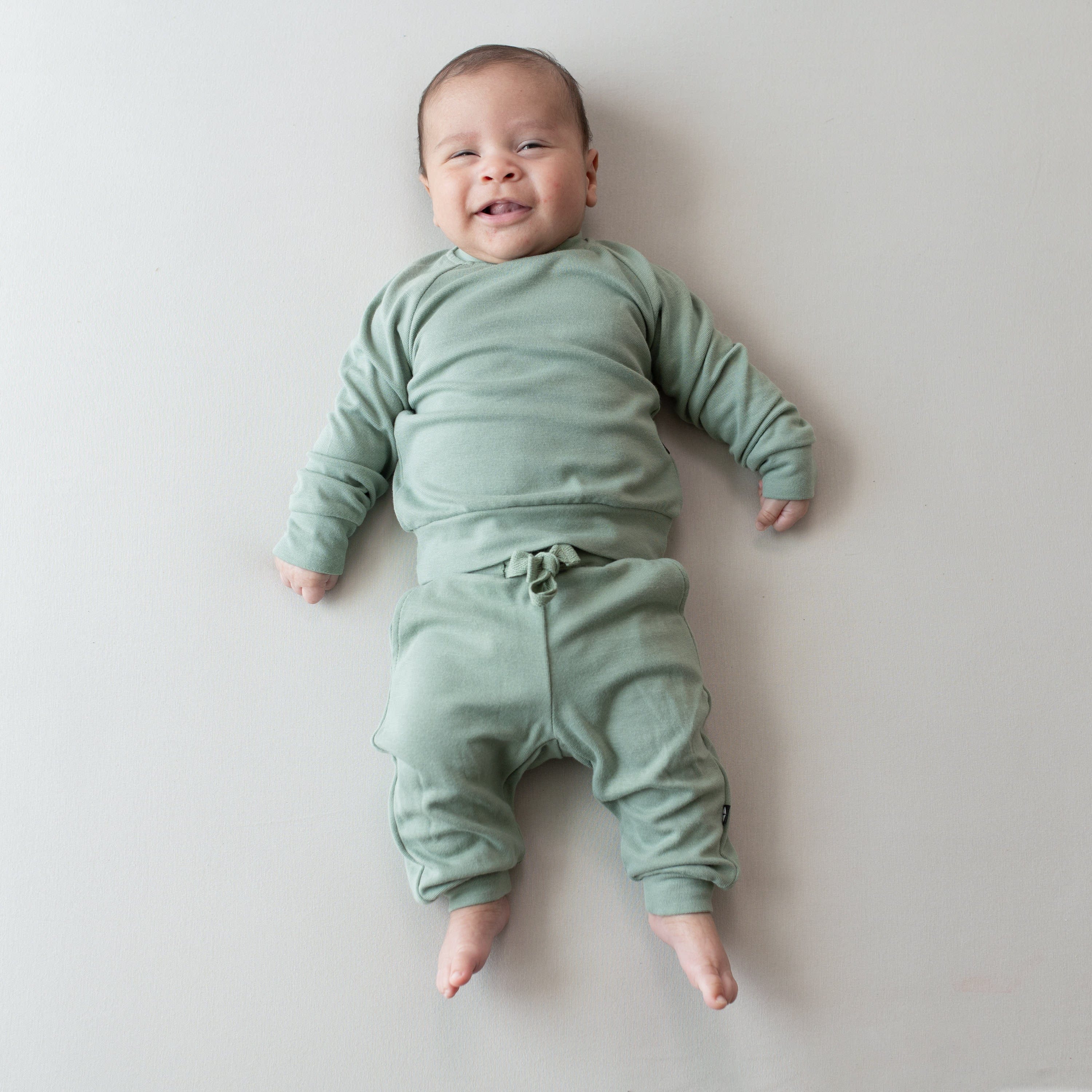 Infant wearing Bamboo Jersey Jogger Set in Thyme