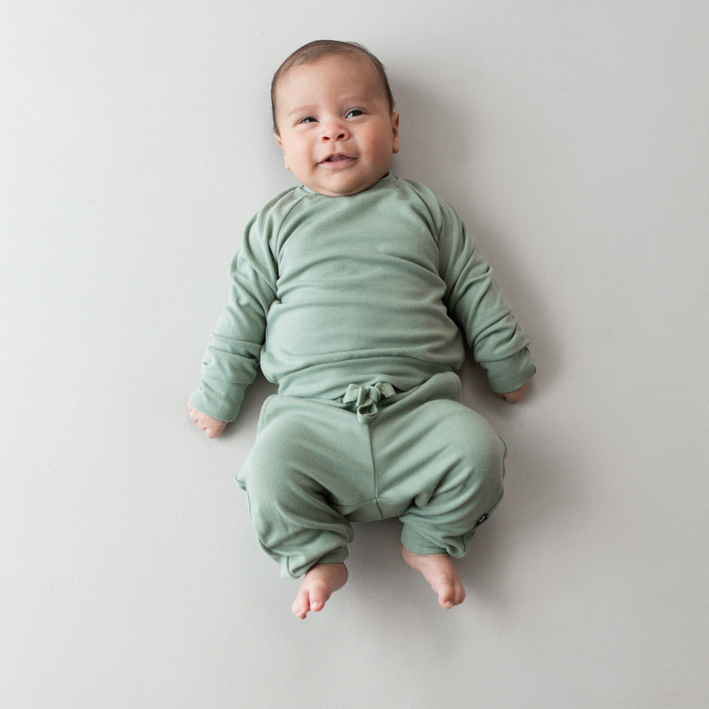 Baby wearing Bamboo Jersey Jogger pajama Set in Thyme