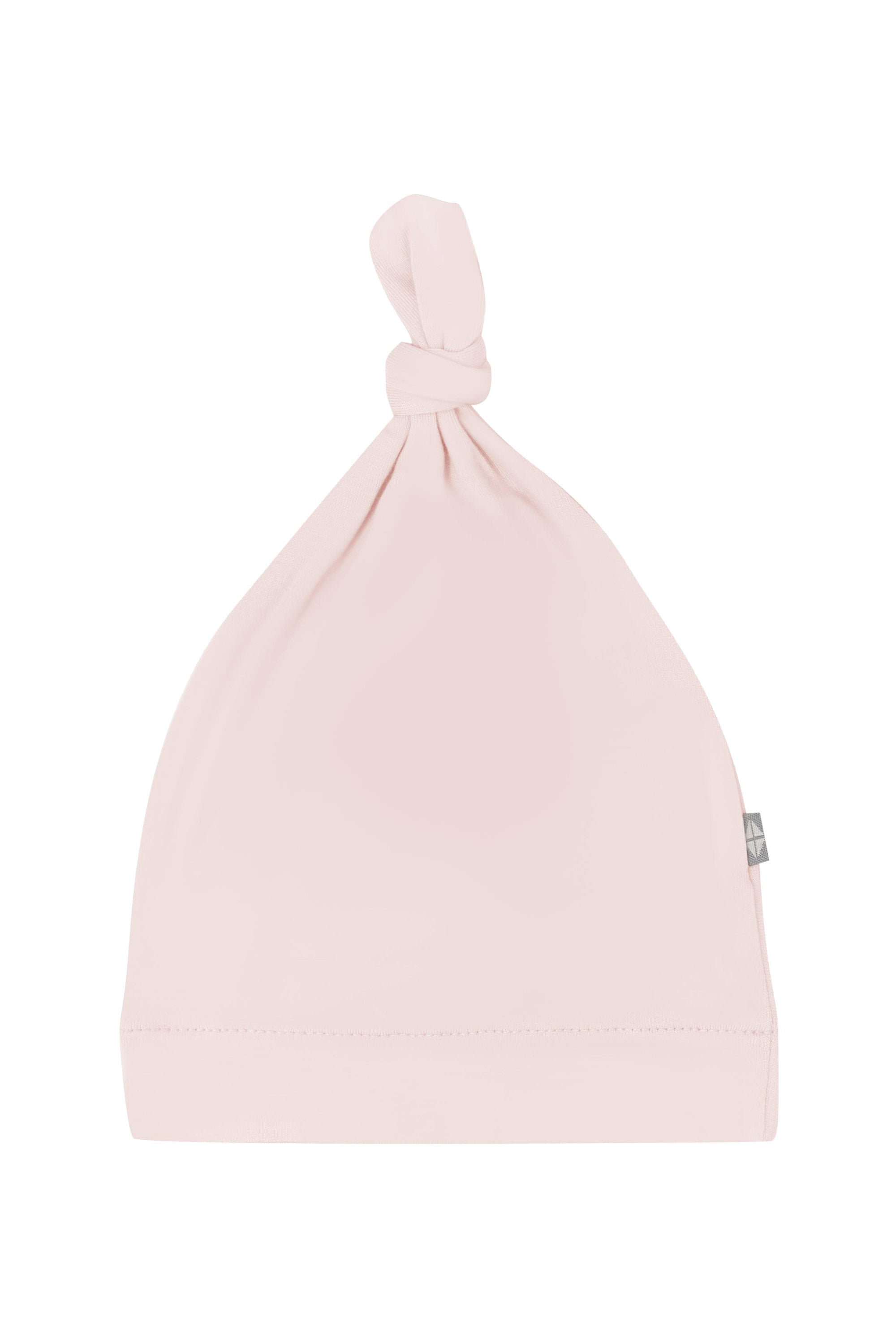 Flat lay of Kyte Baby Knotted Cap in Blush