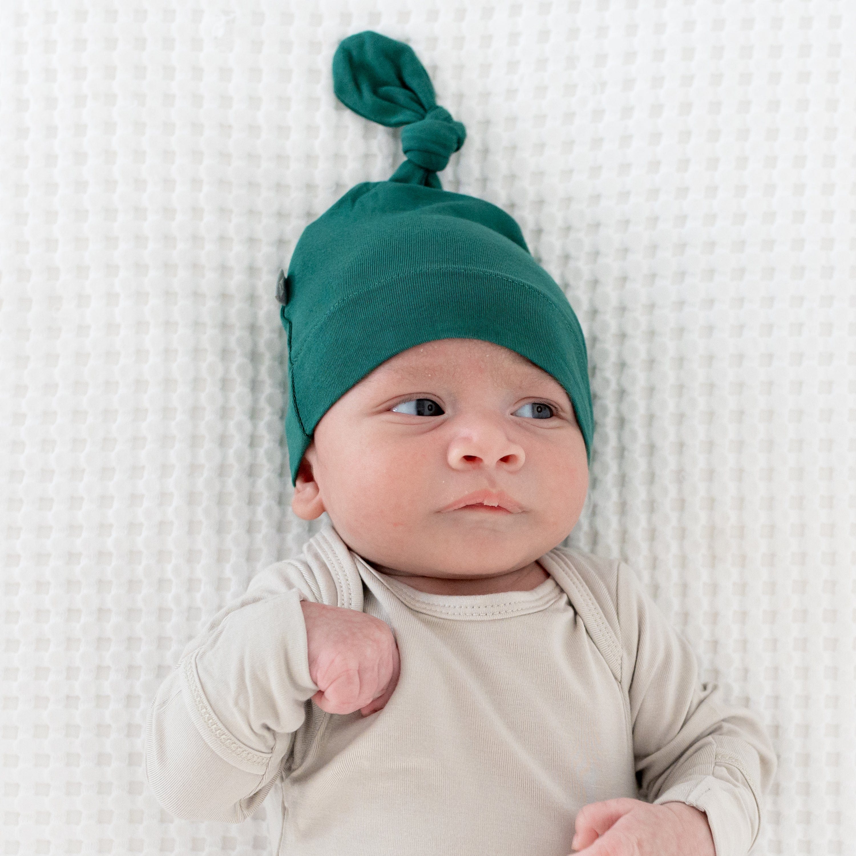 Newborn wearing Knotted Cap in Emerald with a Bodysuit in Oat