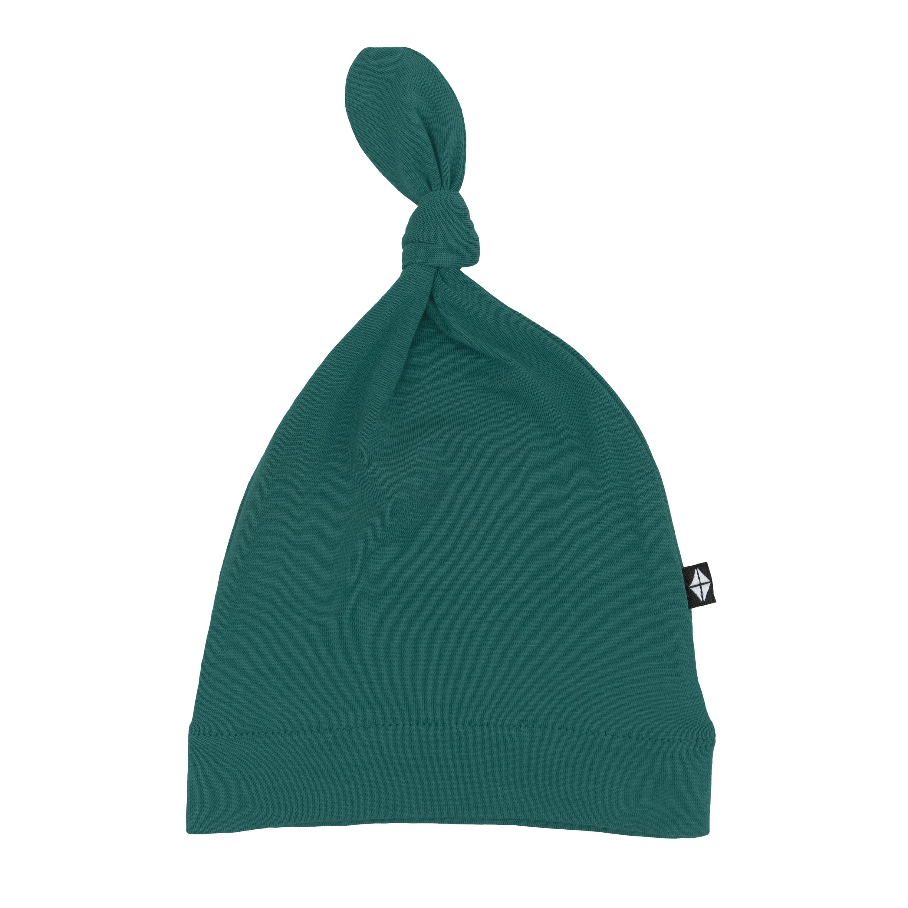 Flat lay of Kyte Baby Knotted Cap in Emerald