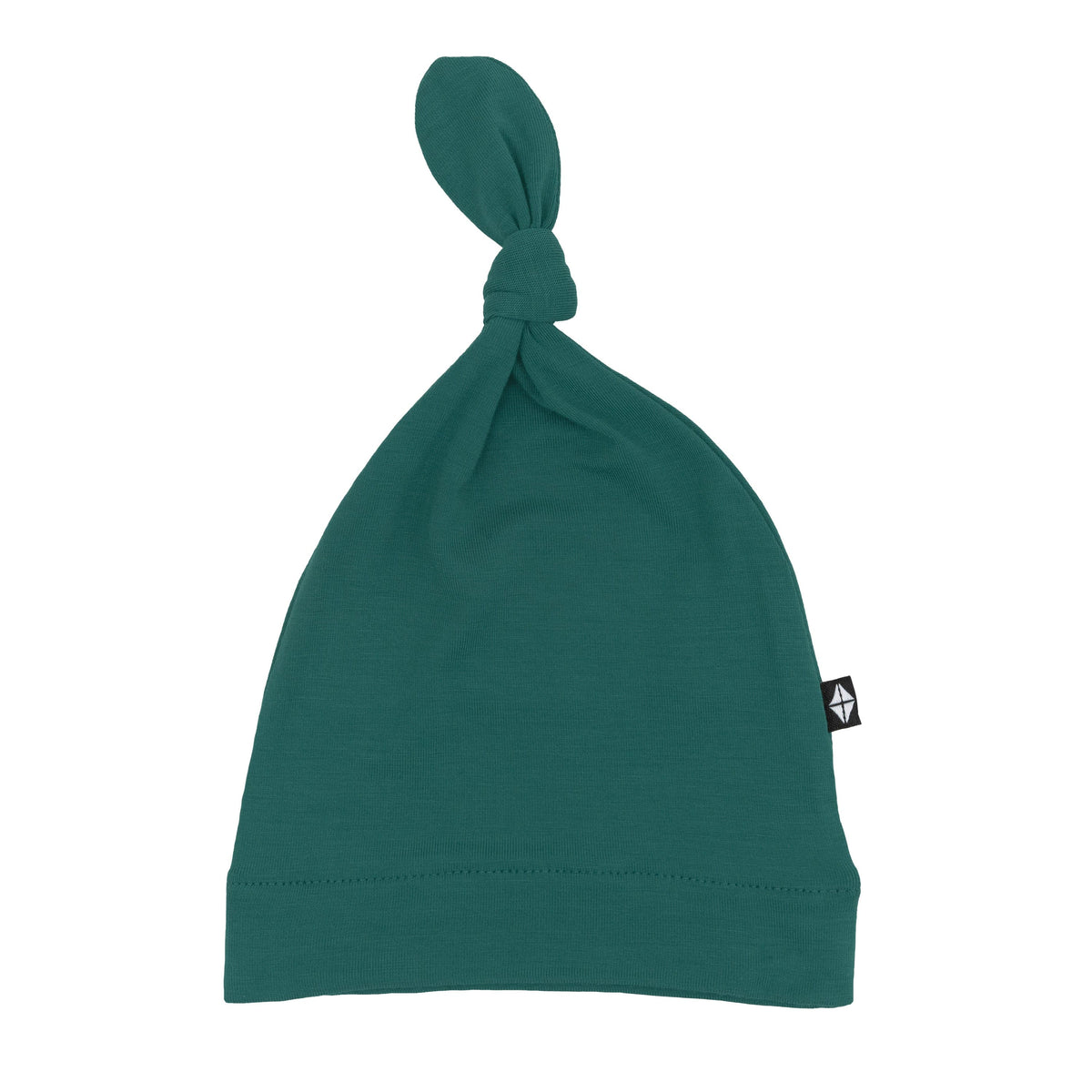 Flat lay of Kyte Baby Knotted Cap in Emerald