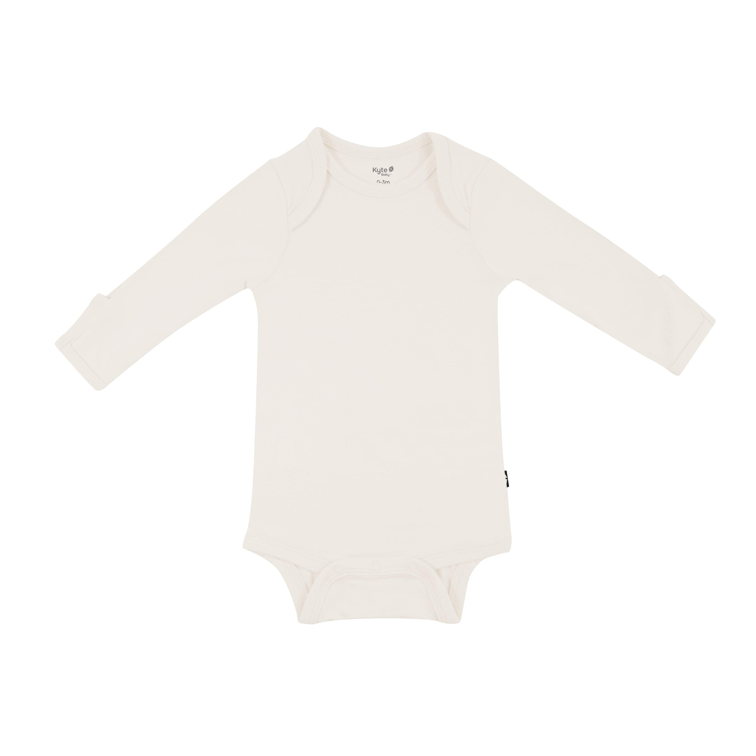 Flat lay of Kyte Baby Long Sleeve Bodysuit in Oat
