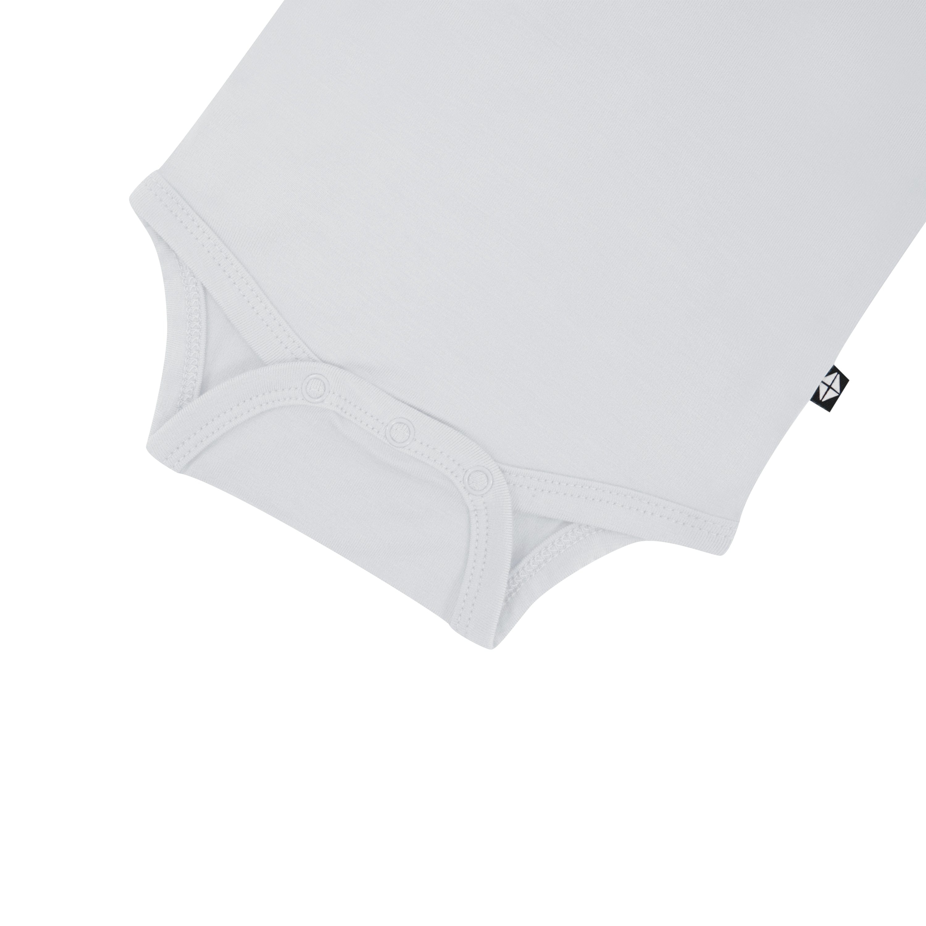 Snap bottom of Kyte Baby Long Sleeve Bodysuit in Storm
