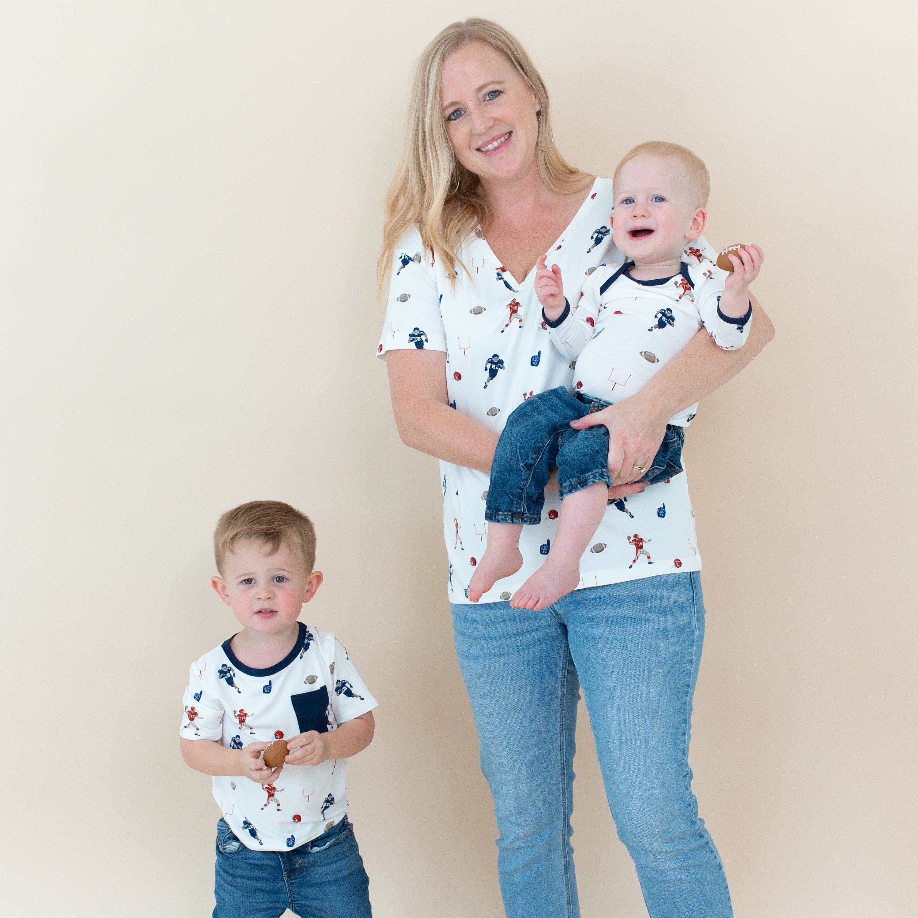 Family wearing matching Kyte Baby tees in Football