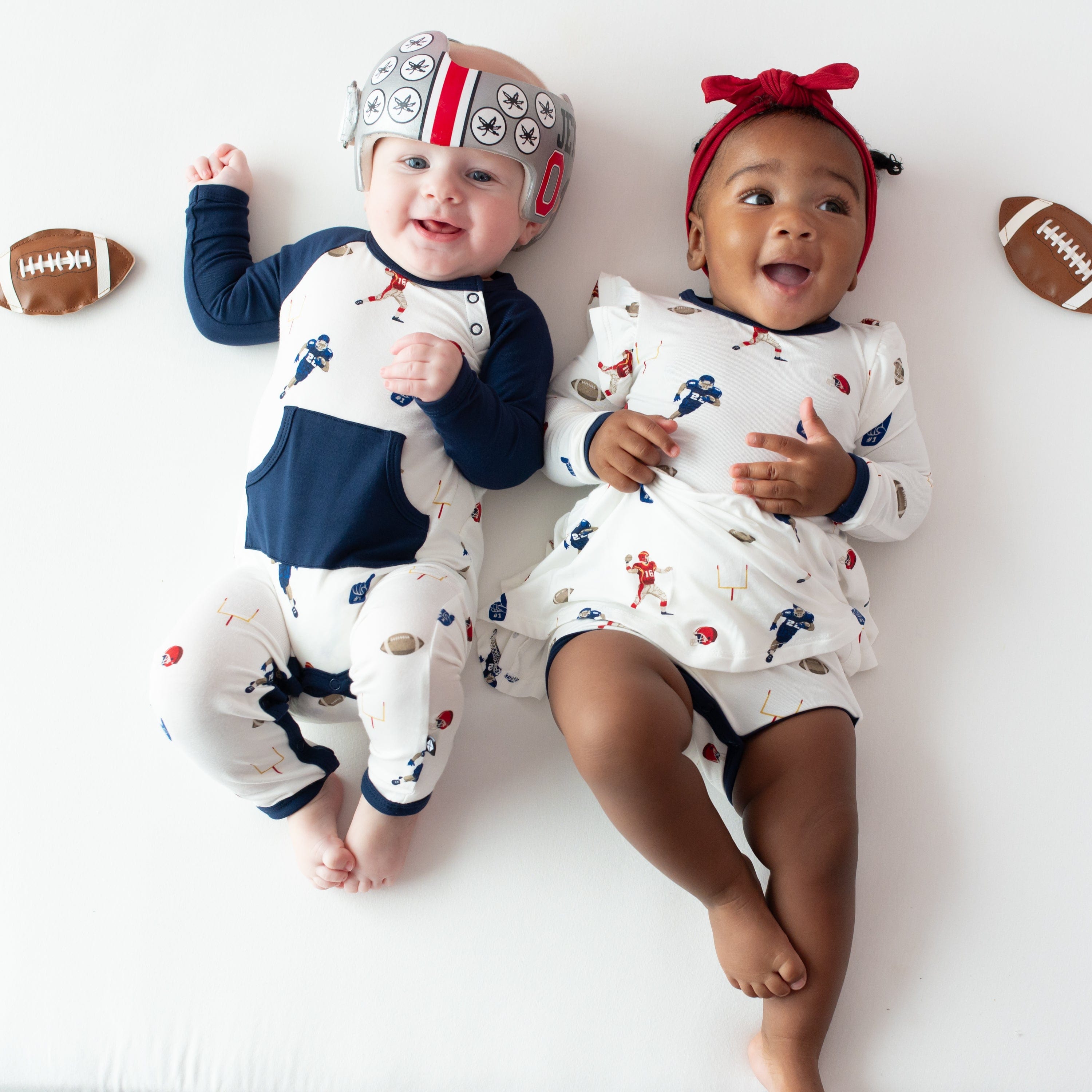 Babies wearing Kyte Baby bamboo clothing in Football print