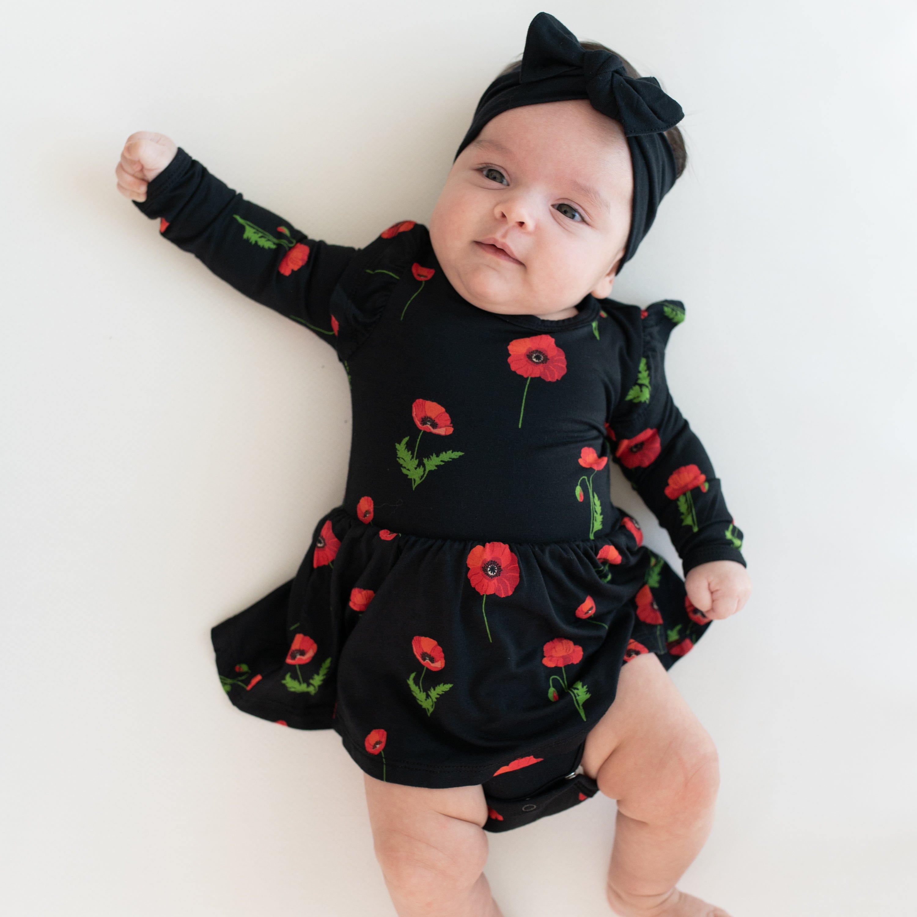 Kyte Baby LS Twirl Bodysuit Dress Long Sleeve Twirl Bodysuit Dress in Midnight Poppies