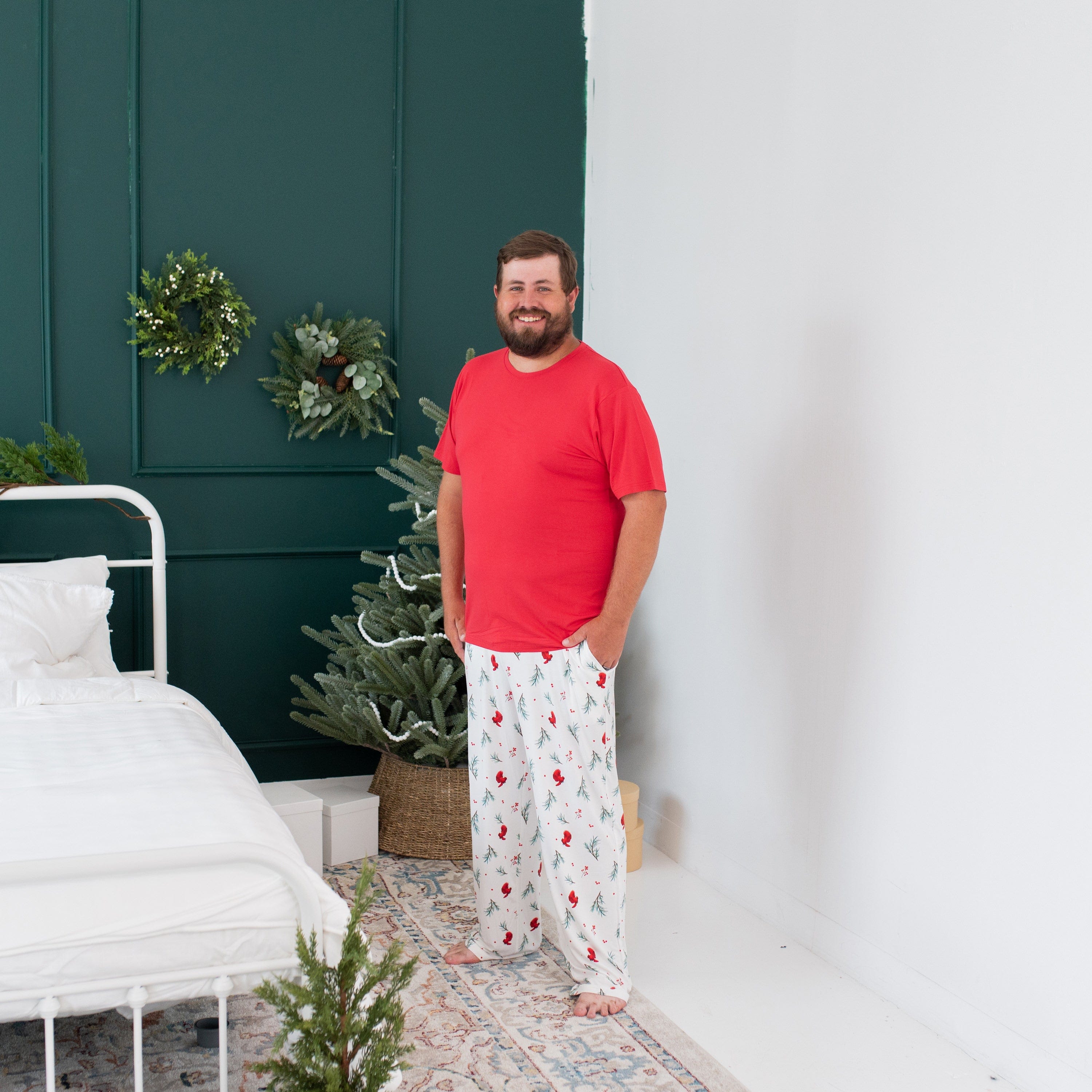 Man wearing Kyte Baby Bamboo Crew Neck Tee in Cardinal red