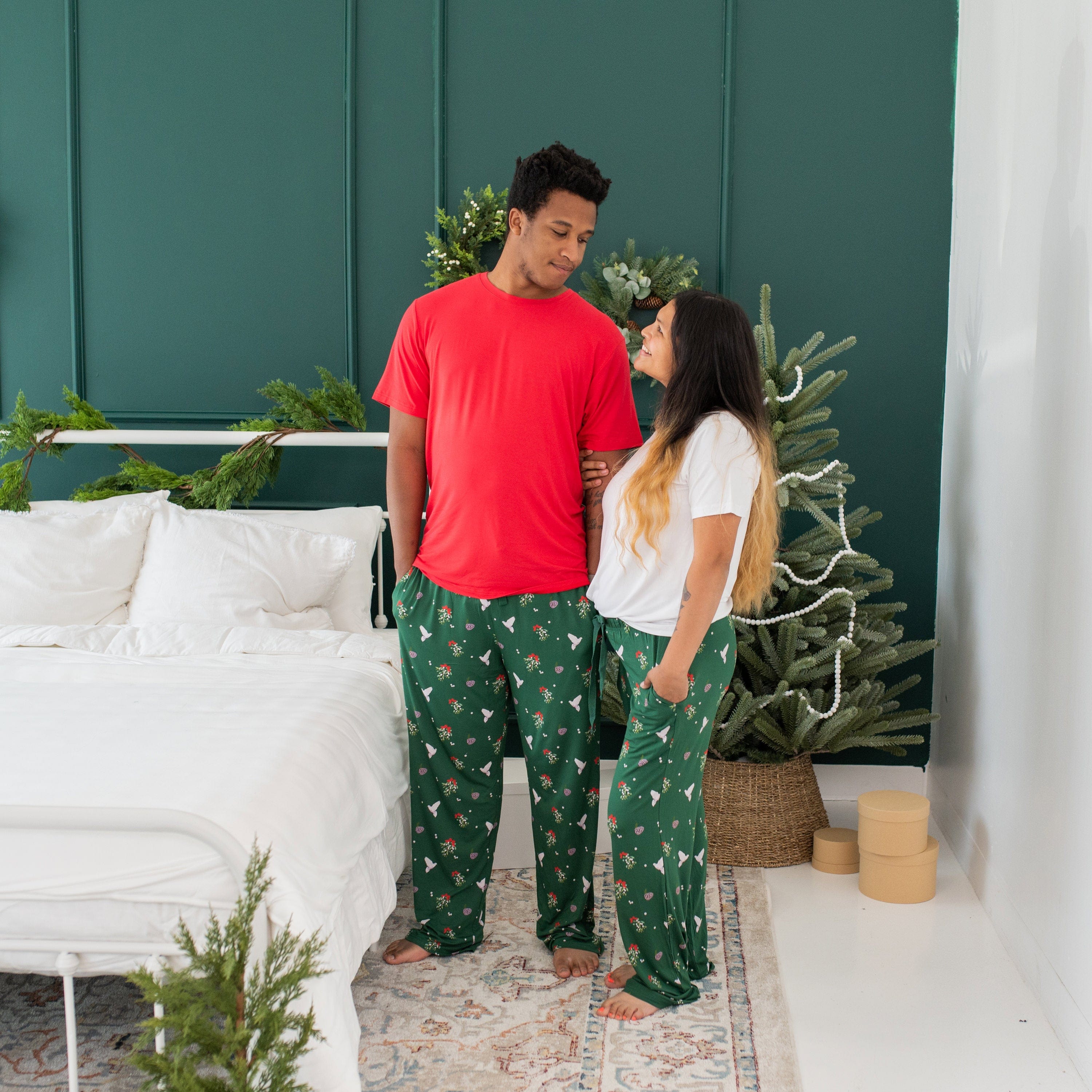 Couple wearing Christmas Pajamas with Kyte Baby Men's Crew Neck Tee in Cardinal