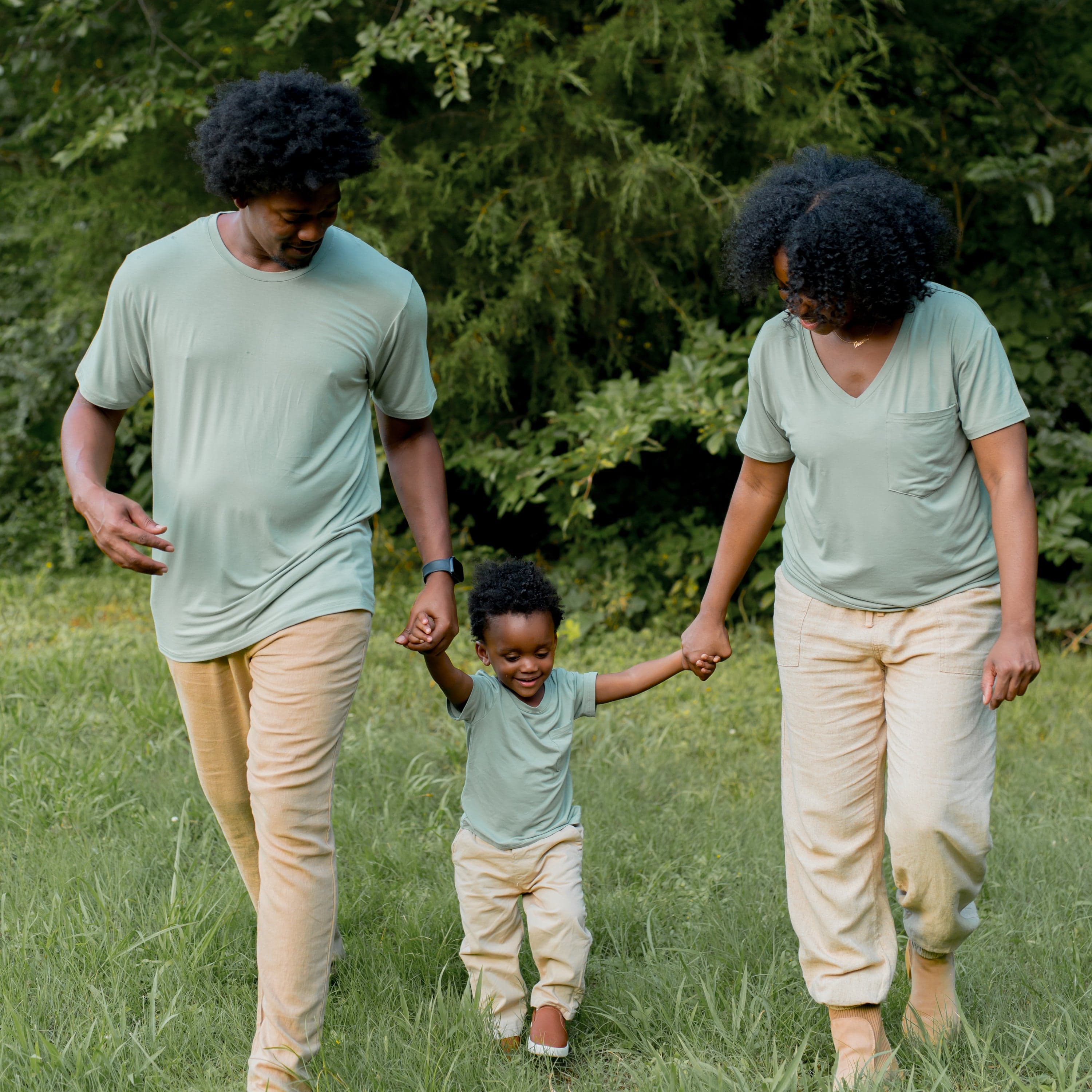 Family wearing matching Kyte Baby t-shirts in Thyme