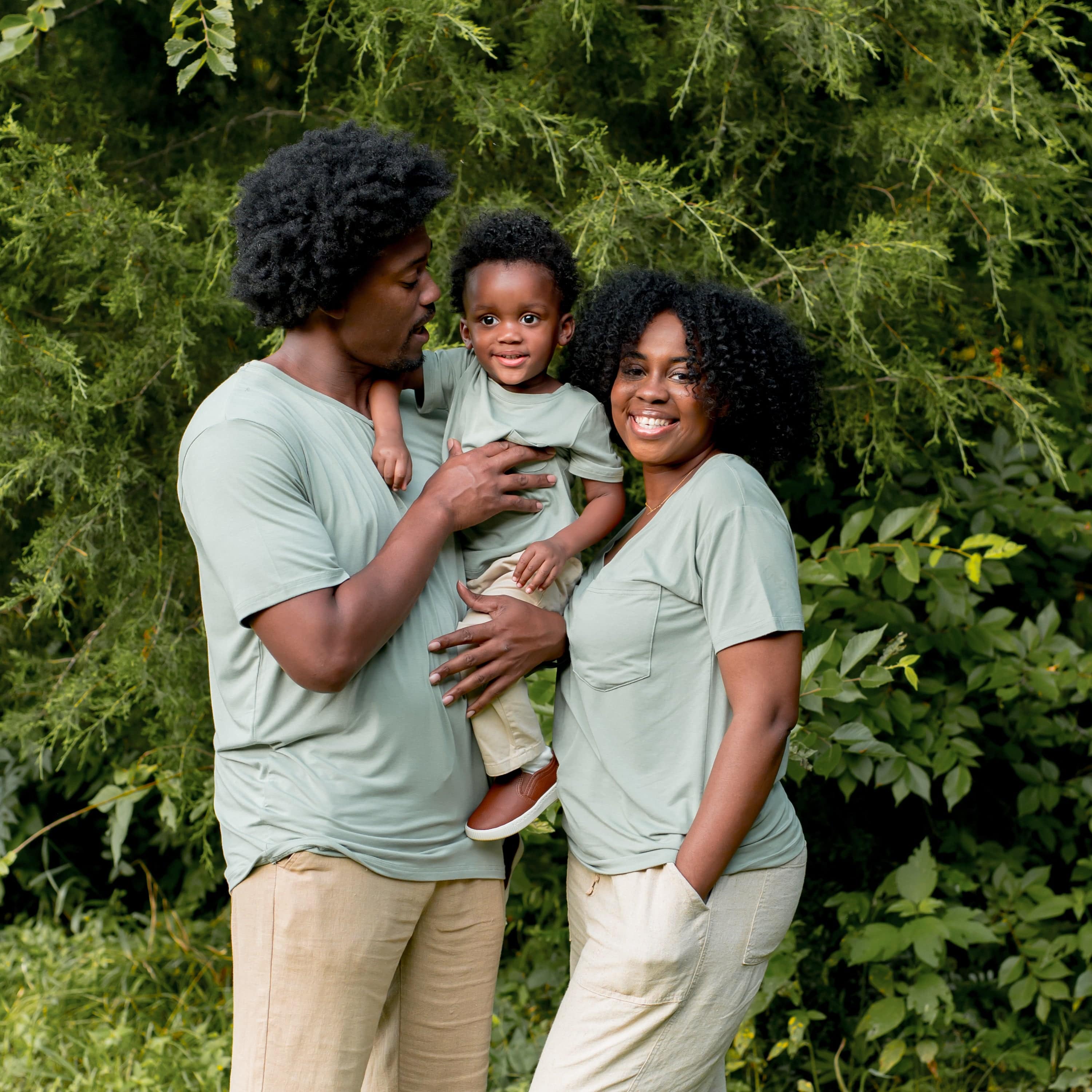 Family wearing matching Kyte Baby tees in Thyme green