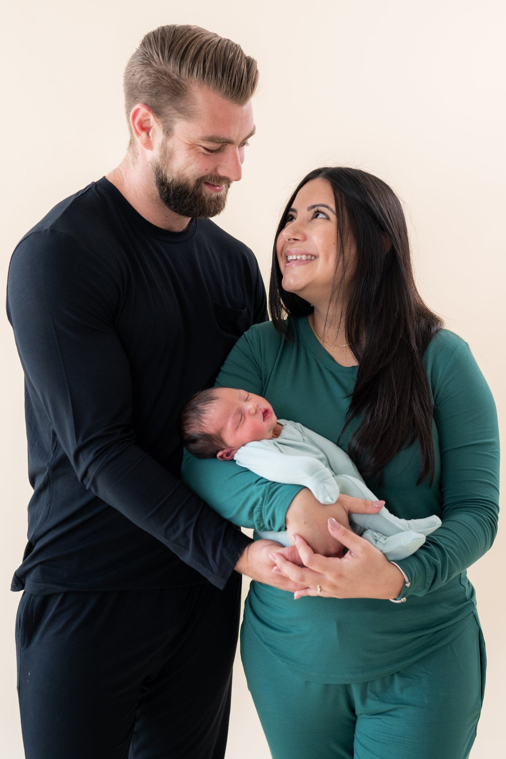 Family wearing matching Kyte Baby bamboo pajamas