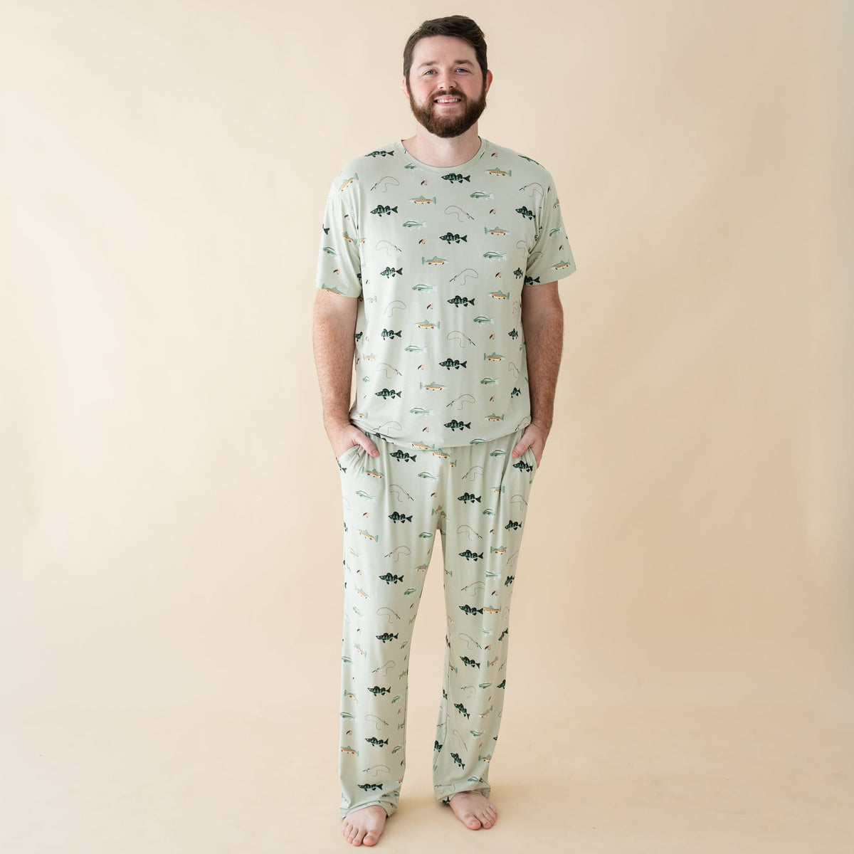 Man wearing Kyte Baby Men's Lounge Pants and Crew Neck Tee in Fishing