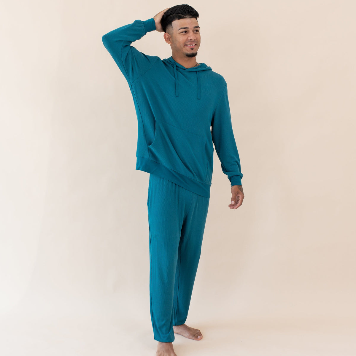 Man wearing Kyte Baby Men's Ribbed Jogger Pant with Hoodie in Loch