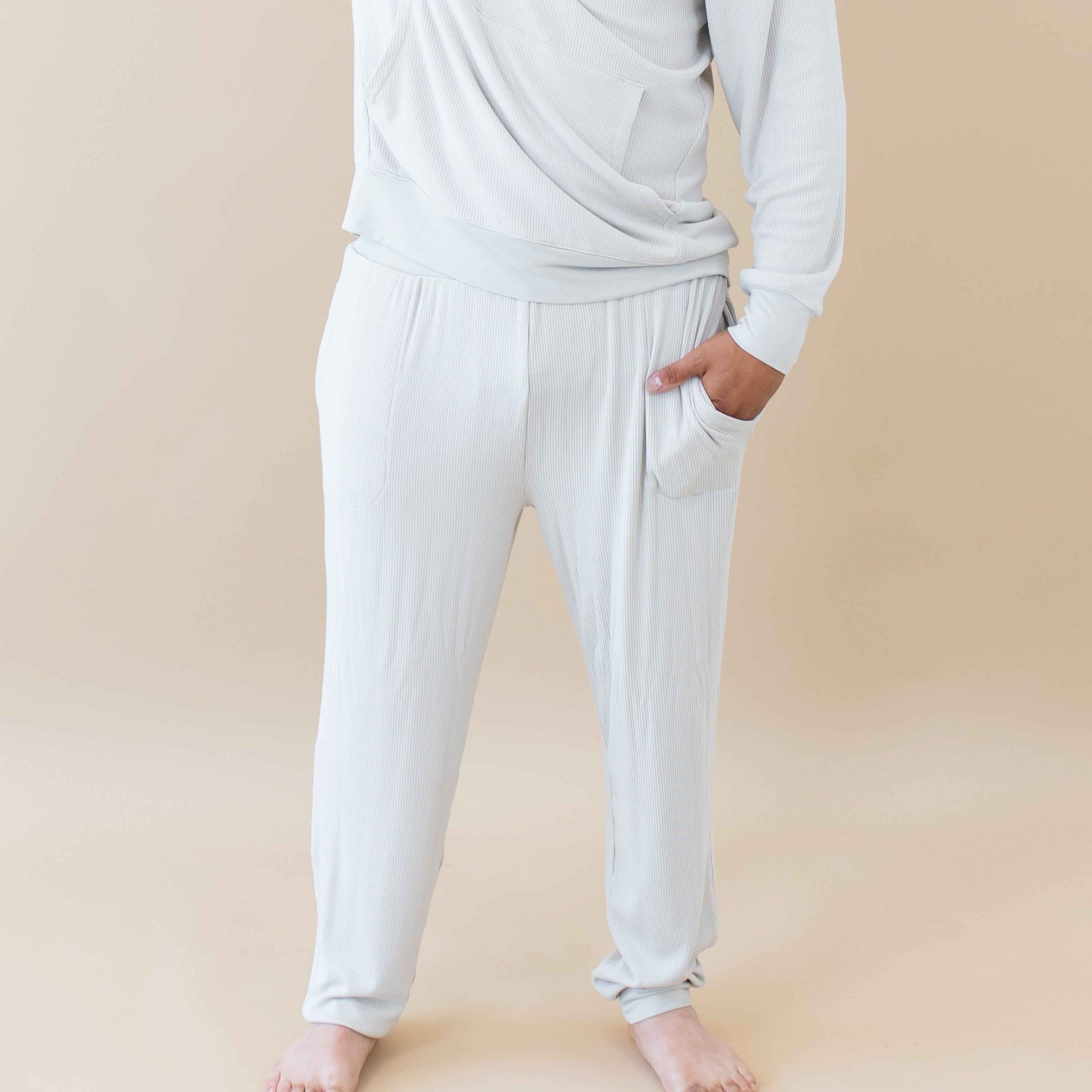 Man wearing Kyte Baby Men's Ribbed Jogger Pant with pockets in Oat