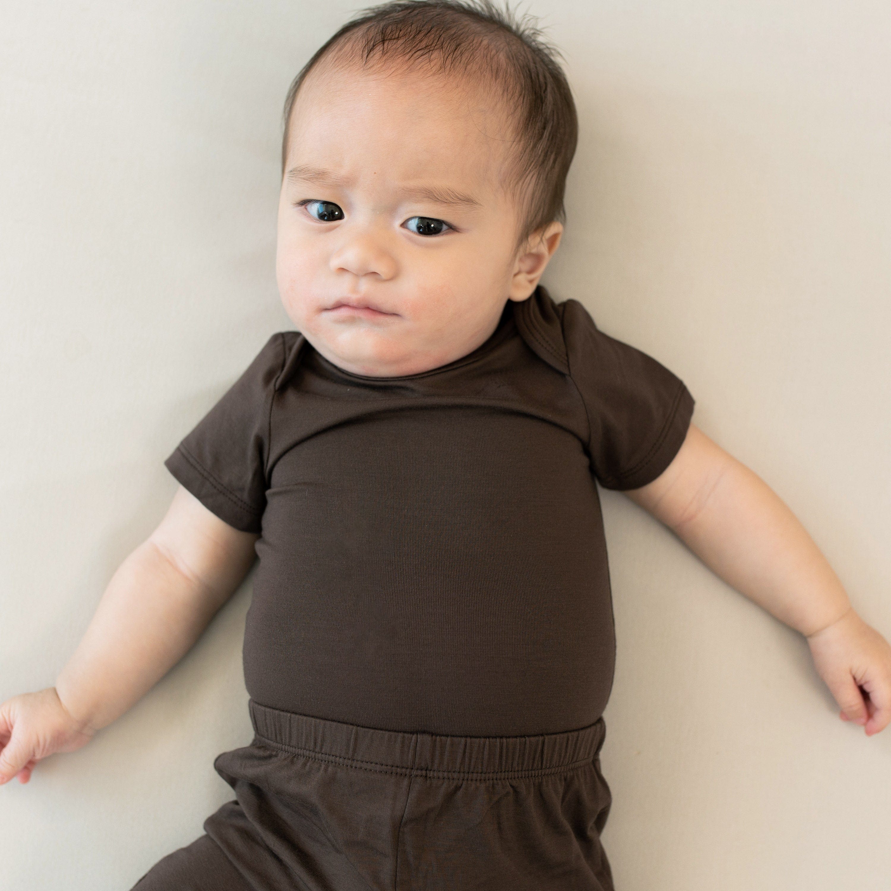Close up of the elastic waistband on the Pant in Espresso paired with a matching short sleeve bodysuit