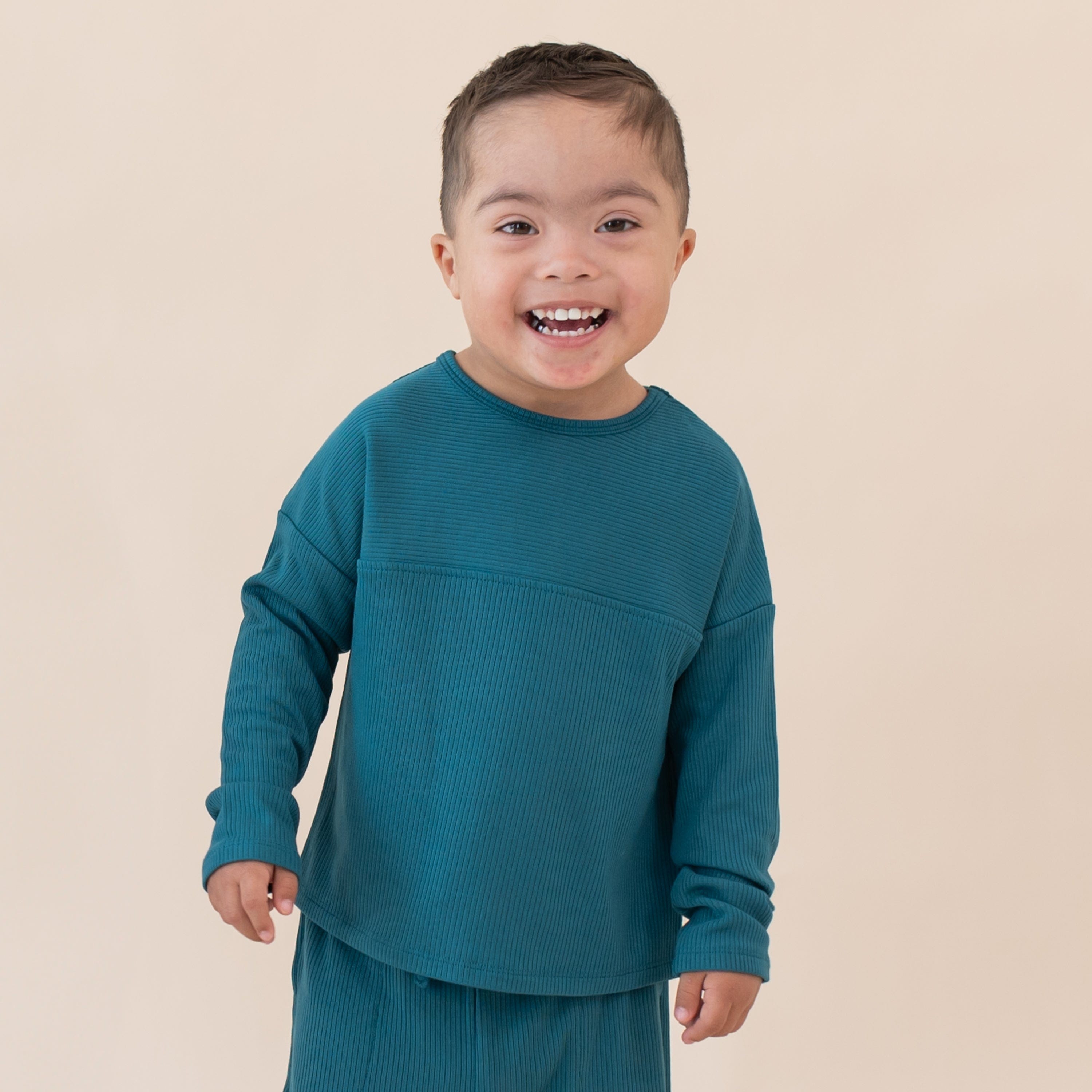 Toddler wearing Kyte Baby Top with Drop Shoulder and Curved Hem in Loch