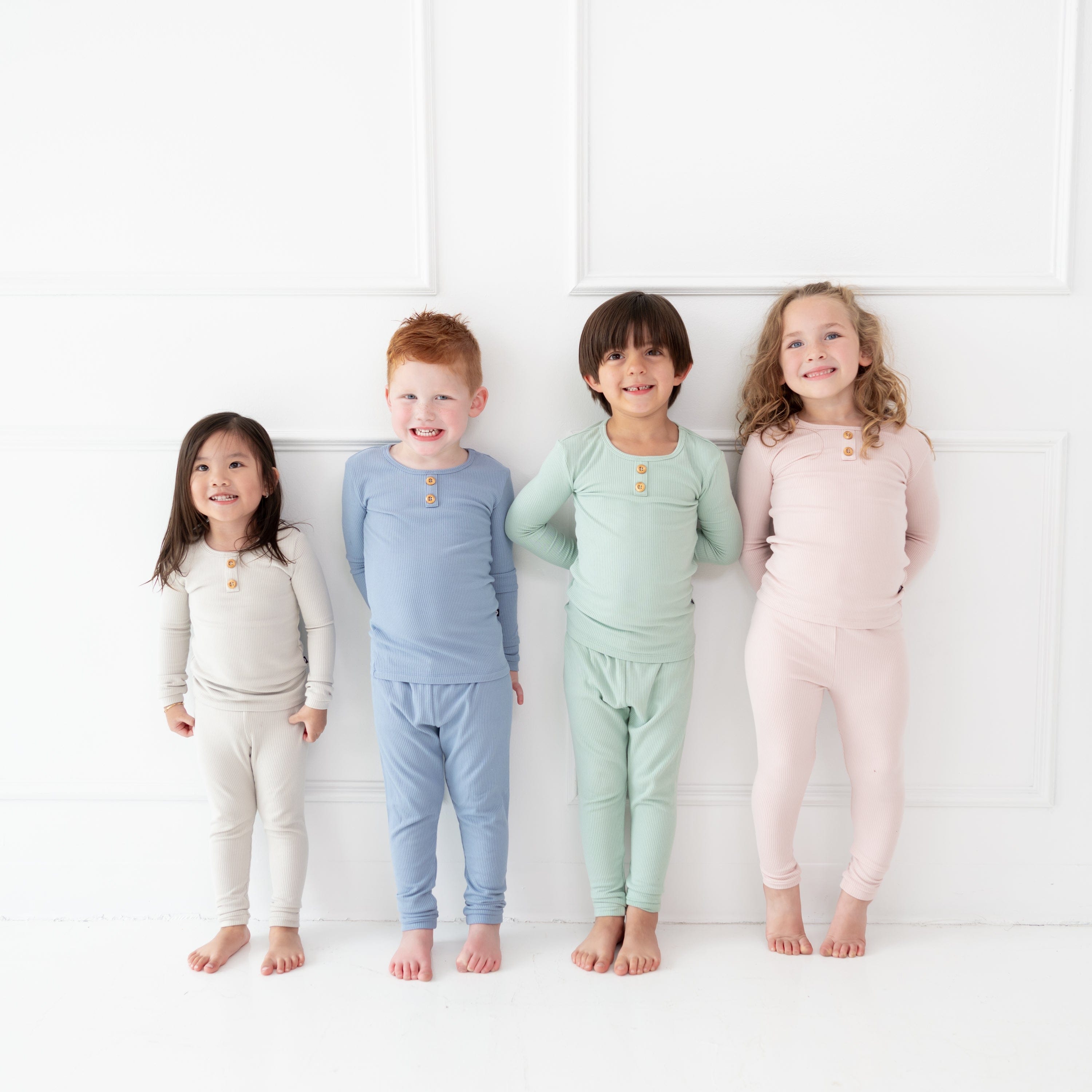 Children wearing Kyte Baby Ribbed Henley Sets