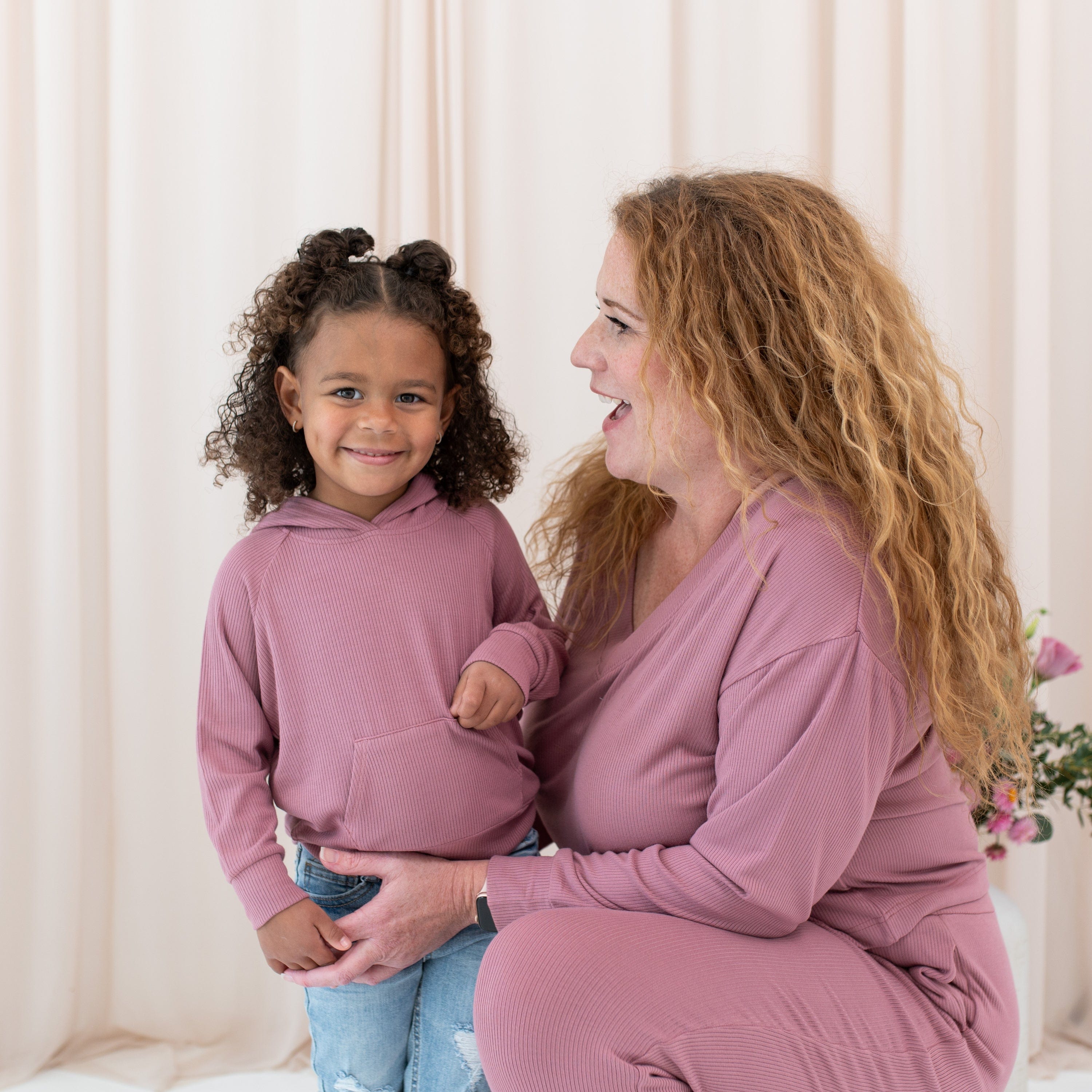 Mom and daughter wearing Kyte Baby matching outfits in Dusty Rose