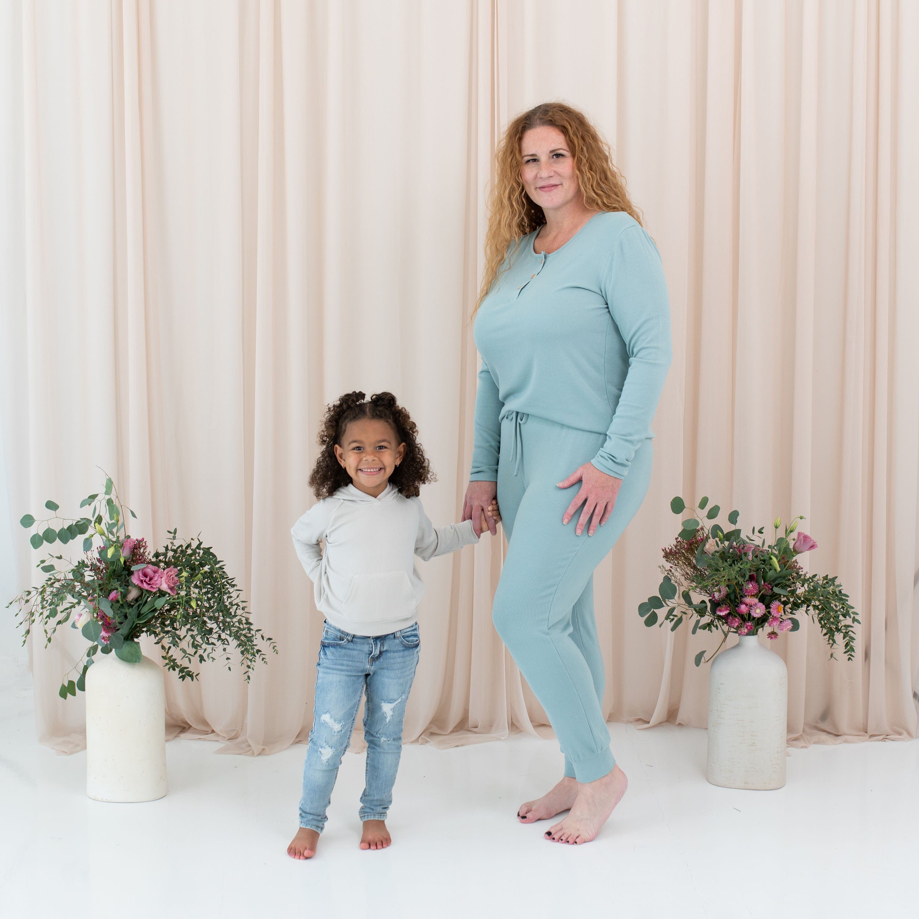 Mom and daughter wearing Kyte Baby ribbed bamboo outfits