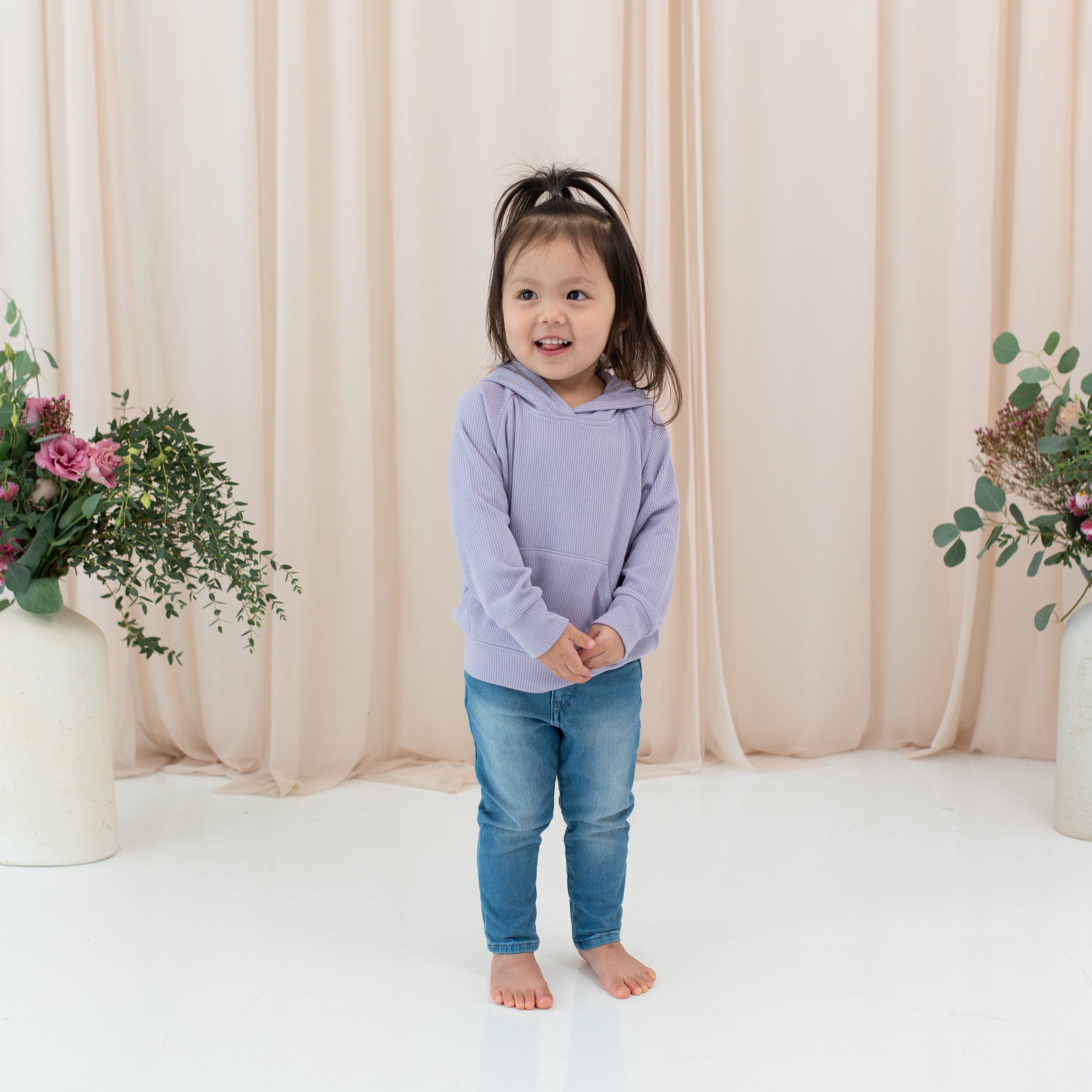 Girl wearing Kyte Baby Ribbed Hoodie in Taro