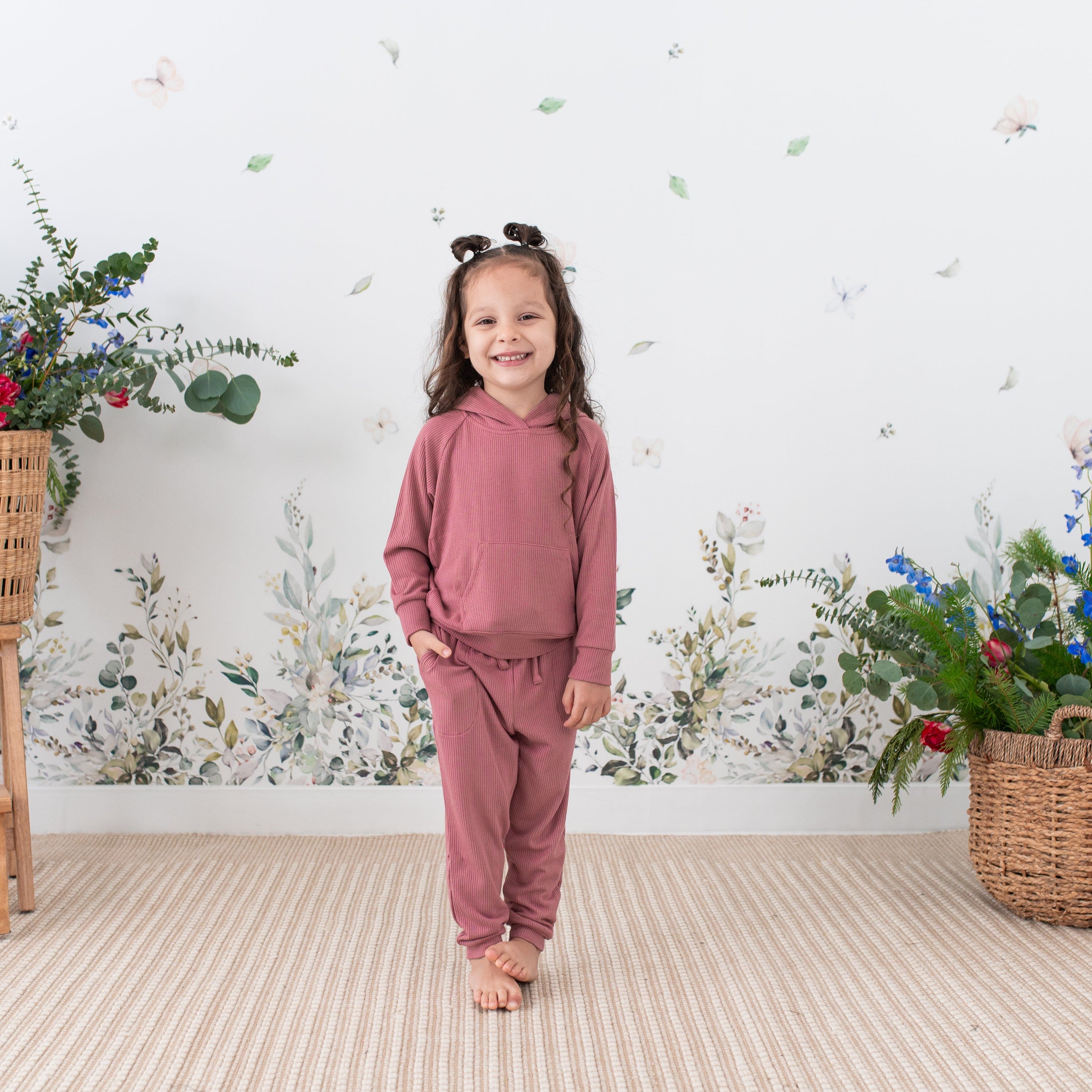 Girl wearing Kyte Baby Ribbed Jogger Pant in Dusty Rose