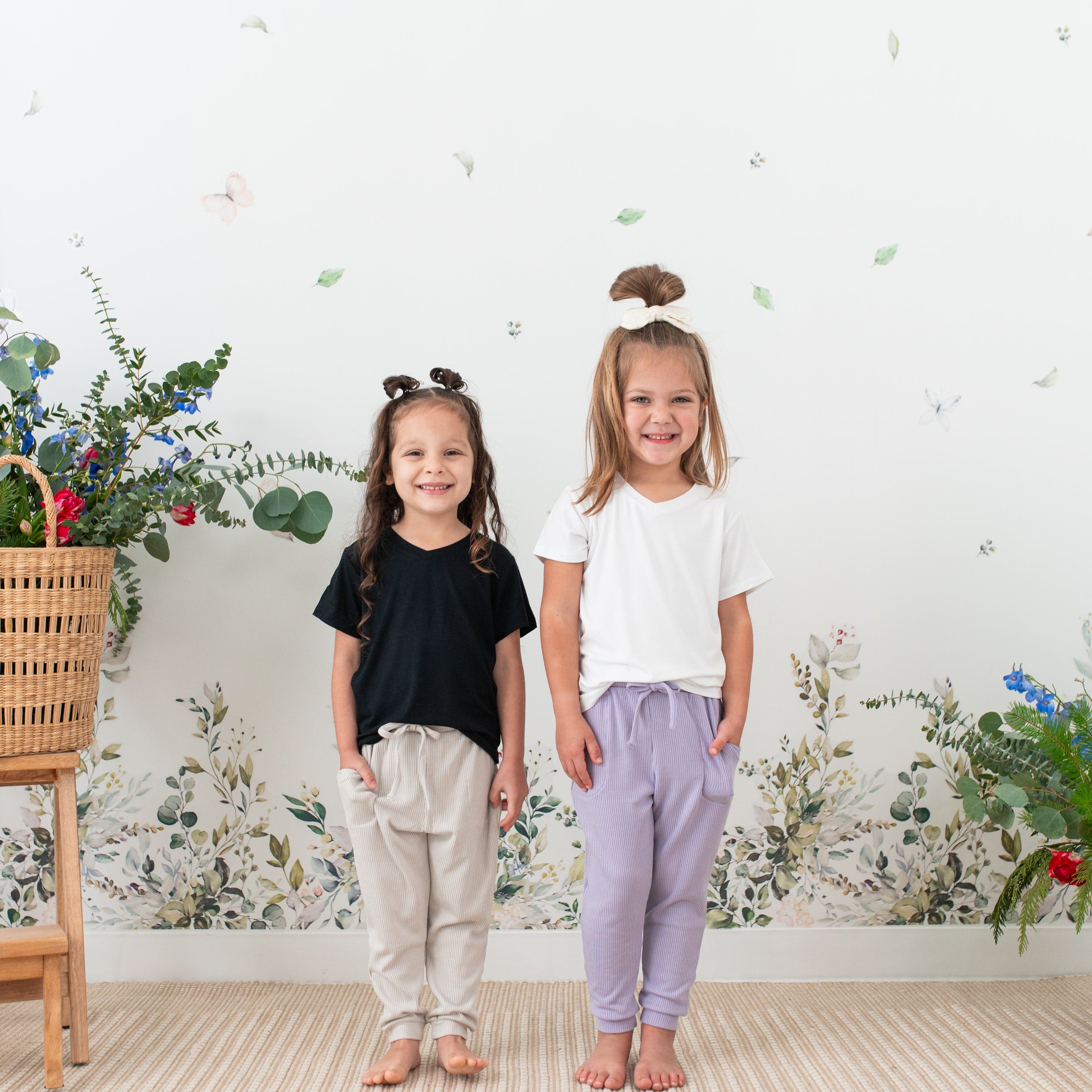 Girls wearing Kyte Baby Ribbed Jogger Pants with ankle cuffs and side pockets