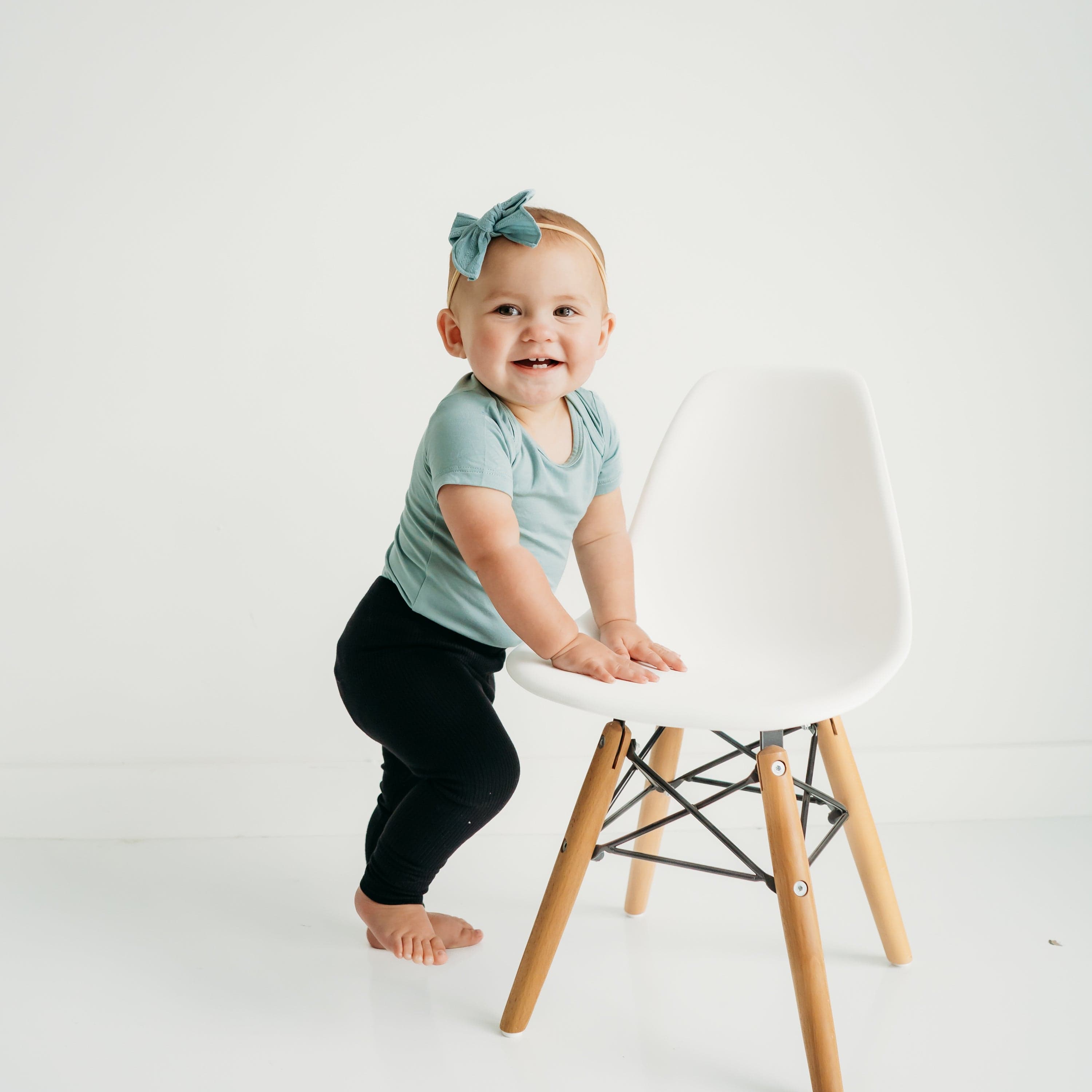 Girl Wearing Kyte Baby Ribbed Leggings in Midnight Black