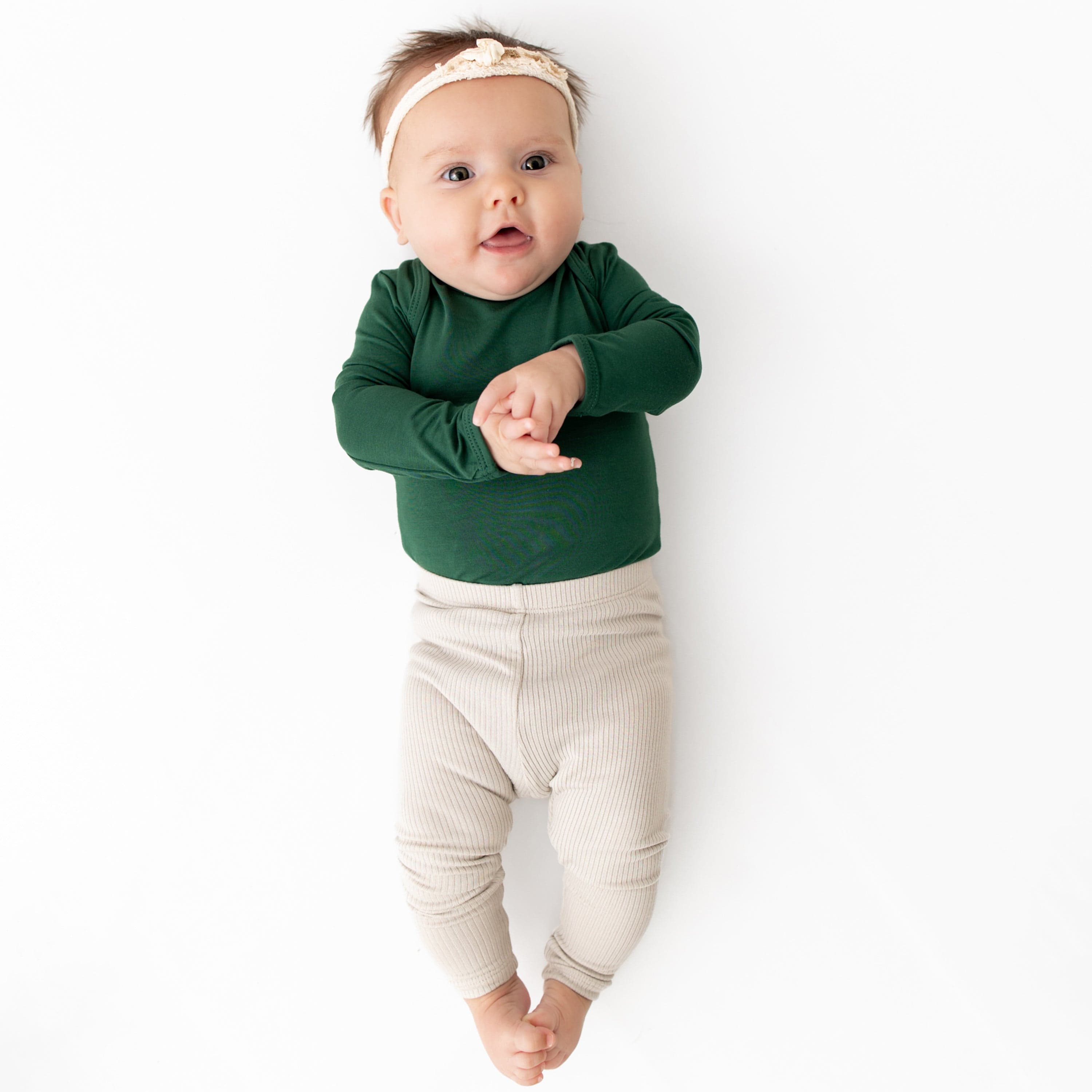 Infant Wearing Kyte Baby Ribbed Leggings with Elastic Waist in Oat