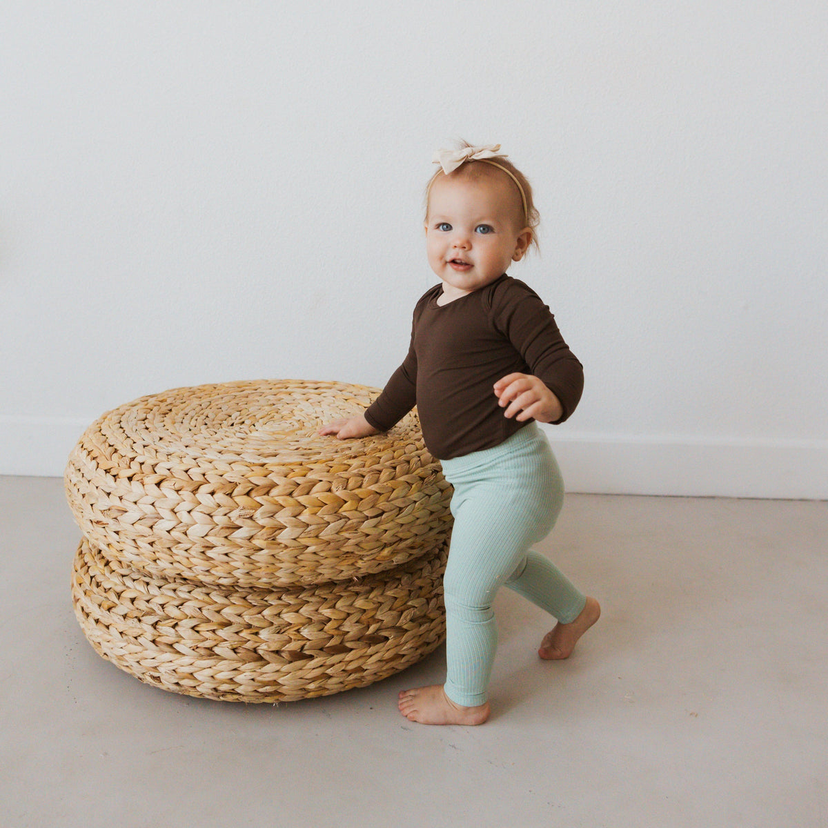 Infant Wearing Kyte Baby Ribbed Leggings in Sage