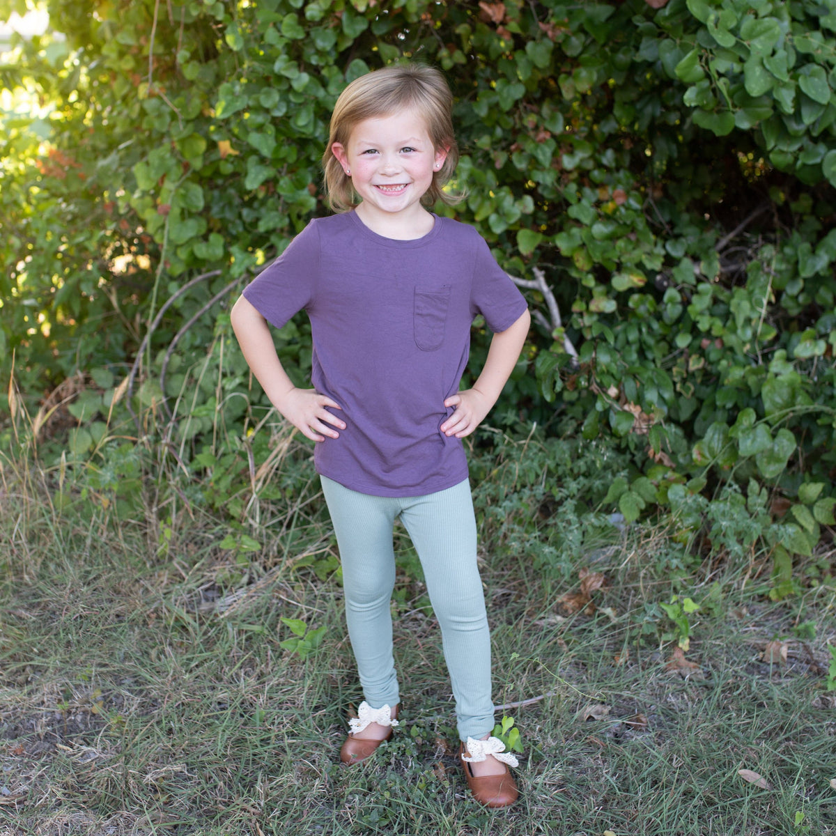 Child wearing Kyte Baby Ribbed Leggings in Thyme