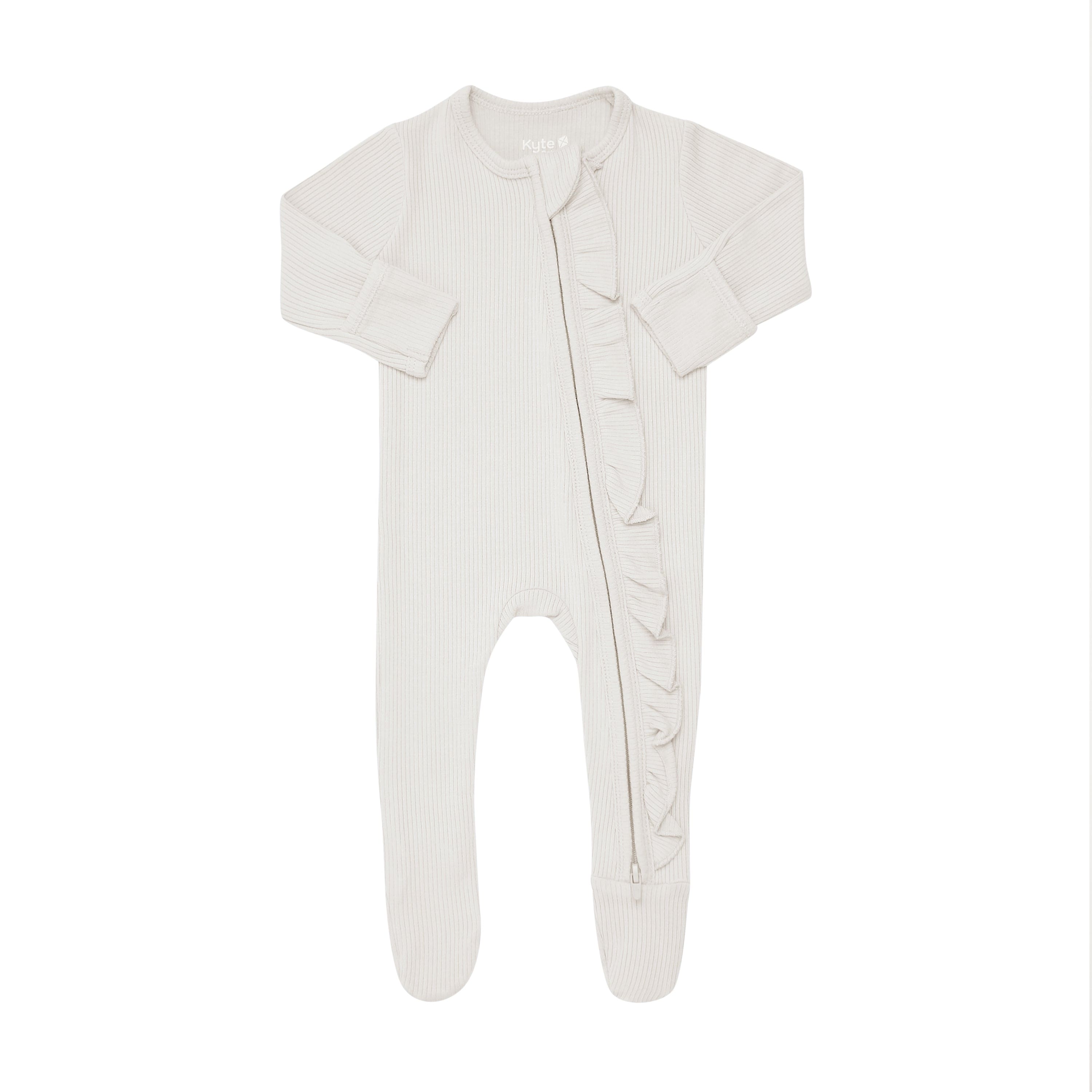 Kyte Baby Ribbed Zippered Footie Pajamas in Oat with Ruffle