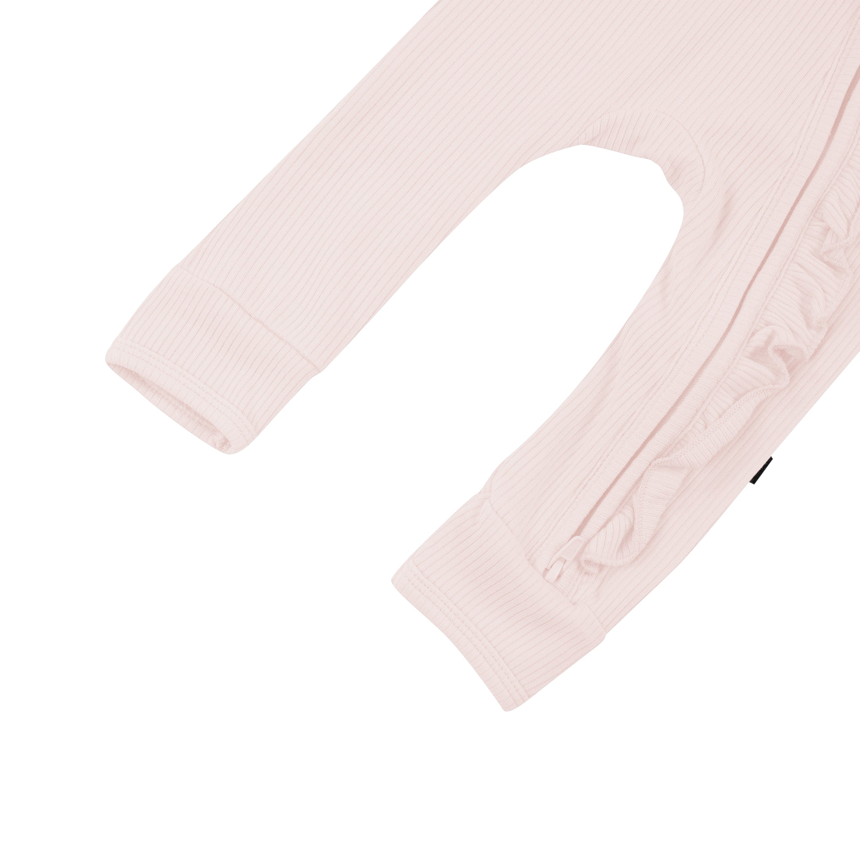 Open feet on Kyte Baby Ribbed Ruffle Zipper Romper in Blush