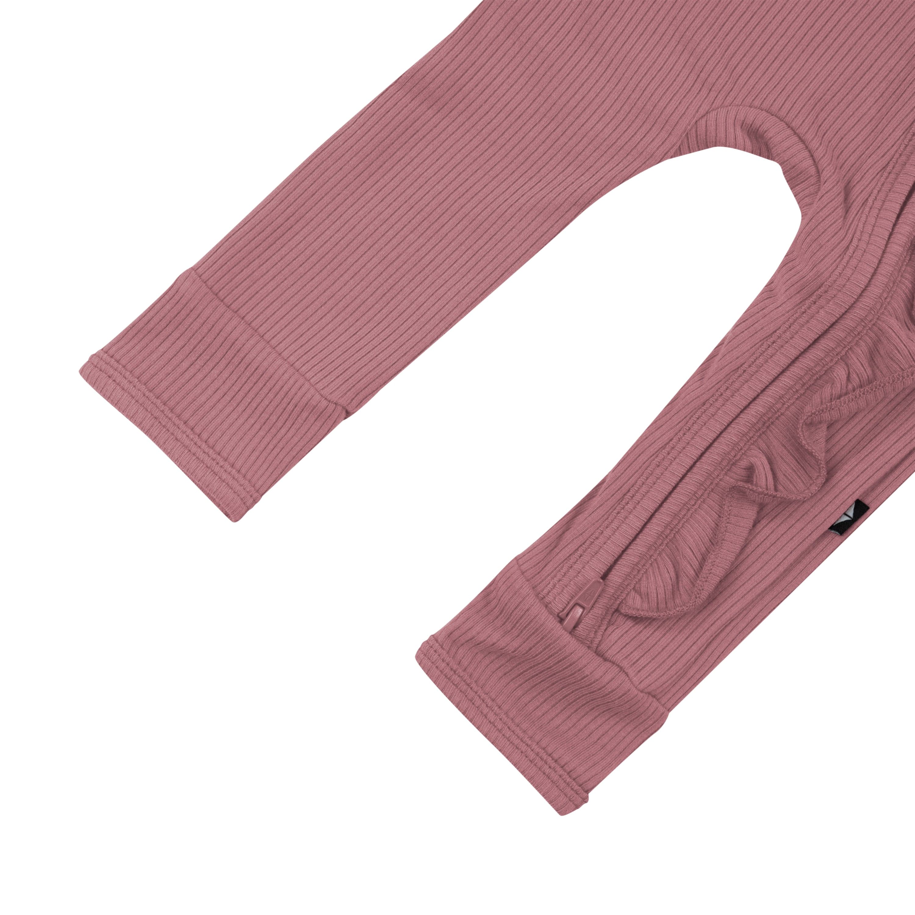 Open feet on Kyte Baby Ribbed Ruffle Zipper Romper in Dusty Rose