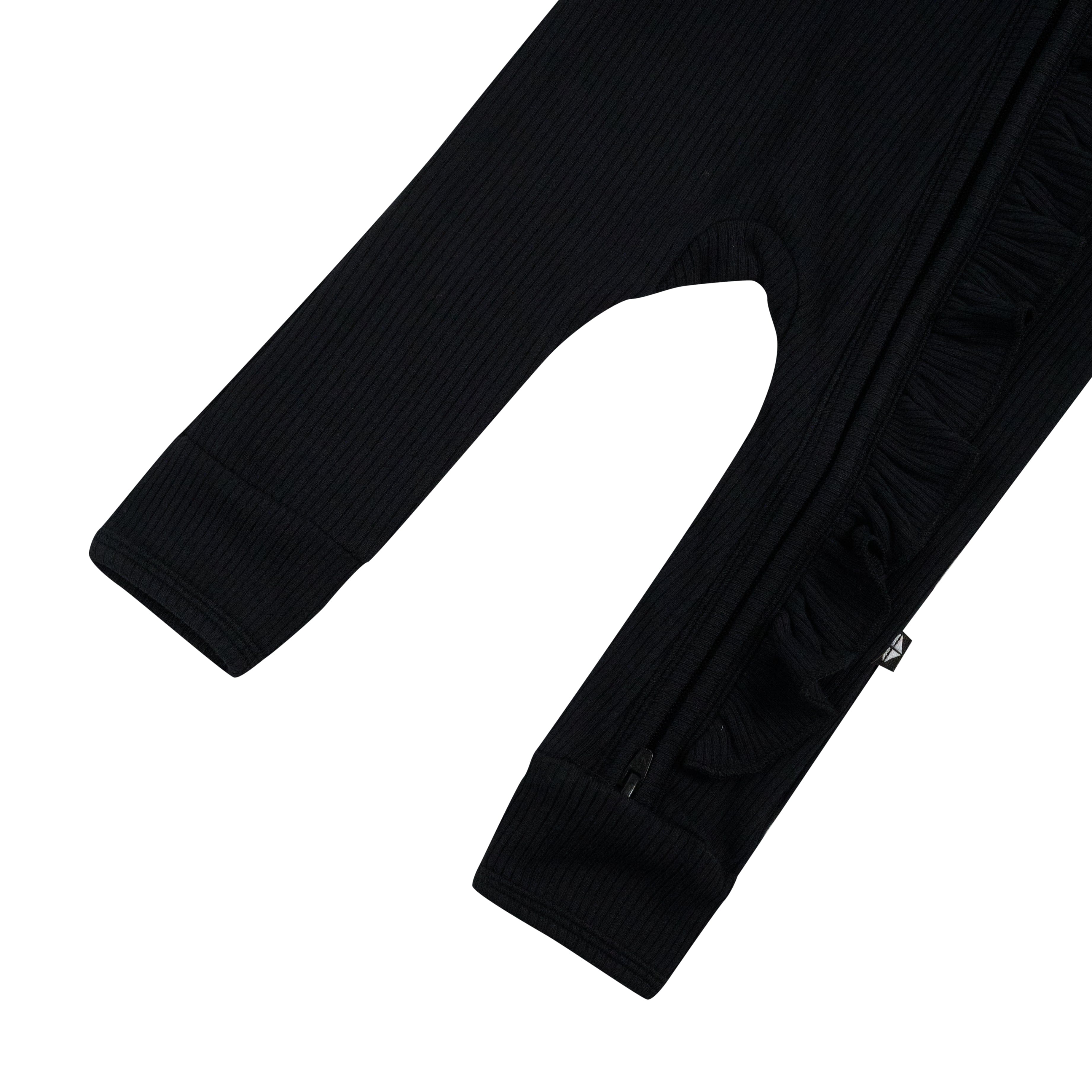 Open feet on Kyte Baby Ribbed Ruffle Zipper Romper in Midnight