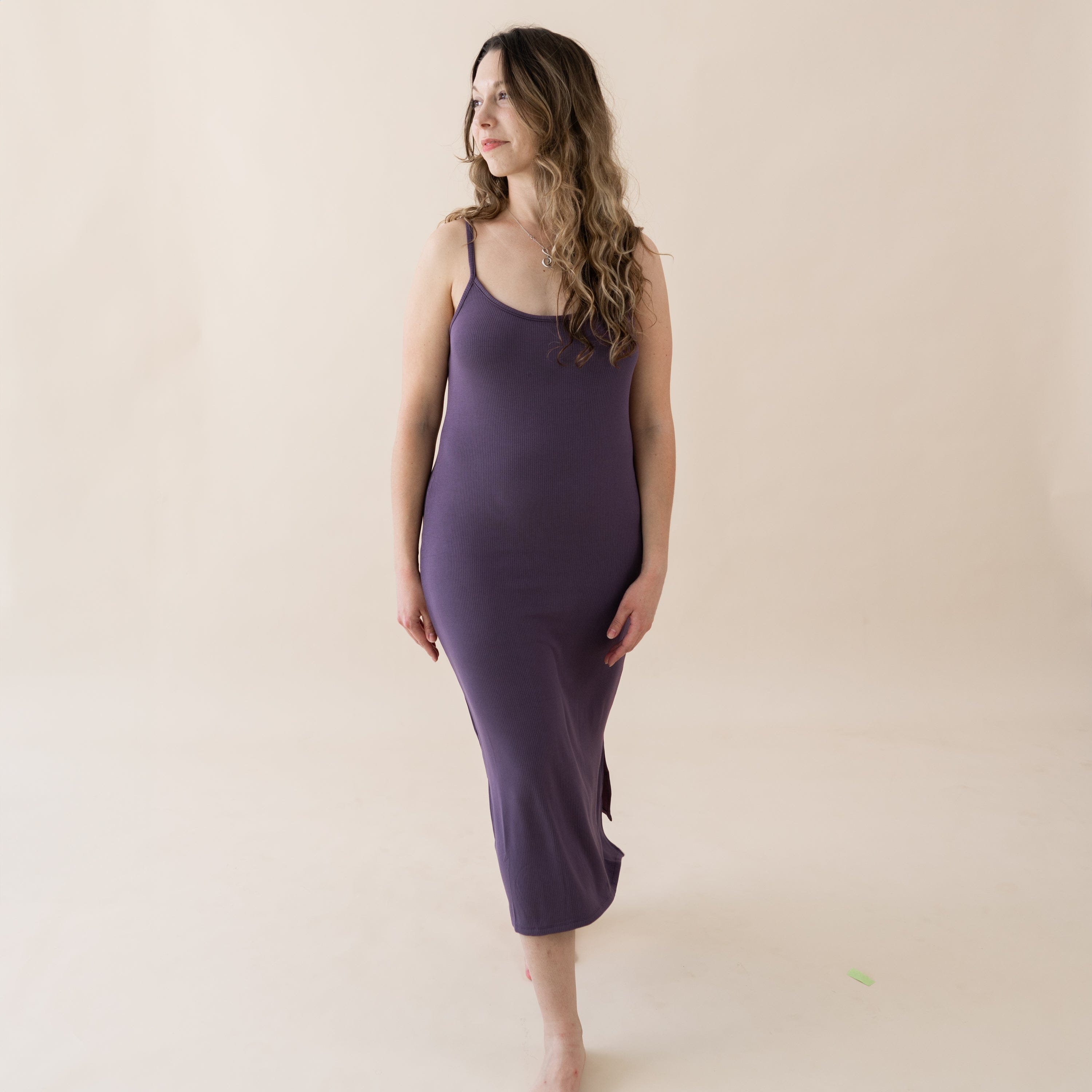 Woman wearing Kyte Baby Ribbed Cami Dress with side slit in Currant