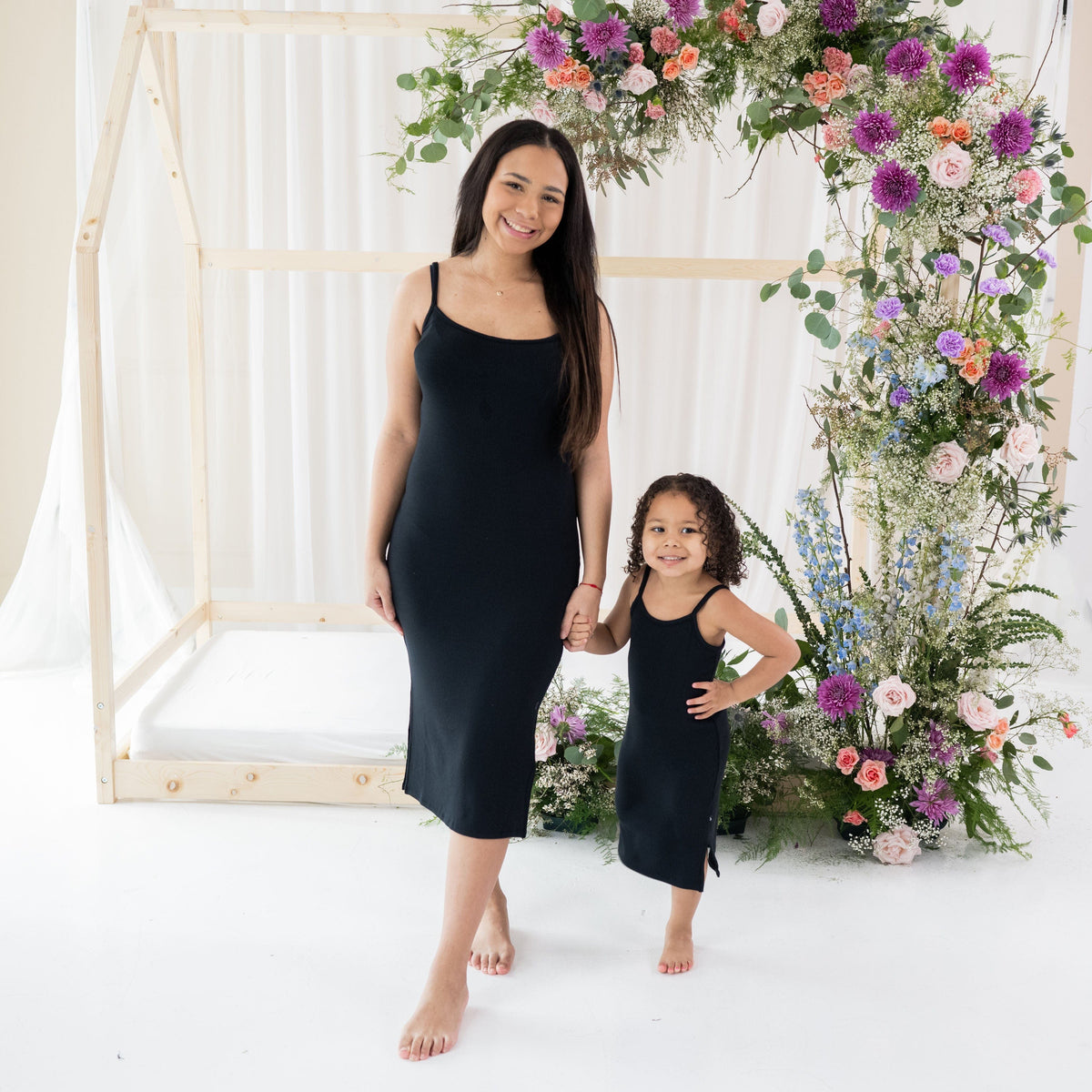 Mom with daughter in matching Kyte Baby Cami Dresses in Midnight
