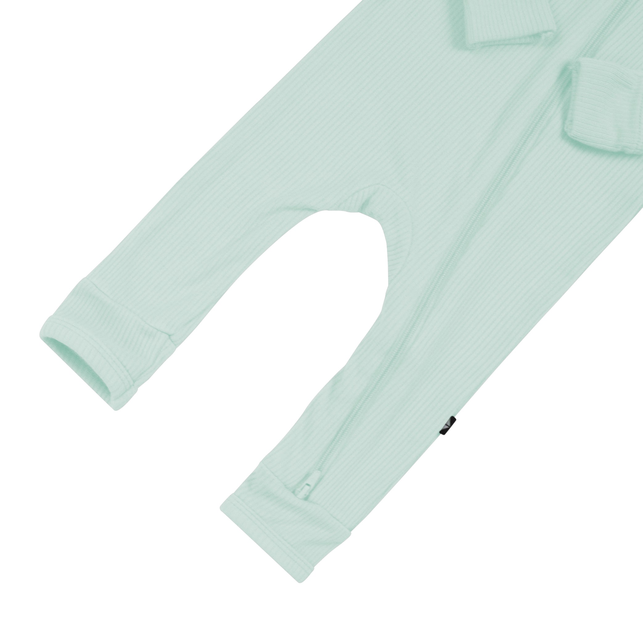Open feet on Kyte Baby Ribbed Zippered Romper in Sage