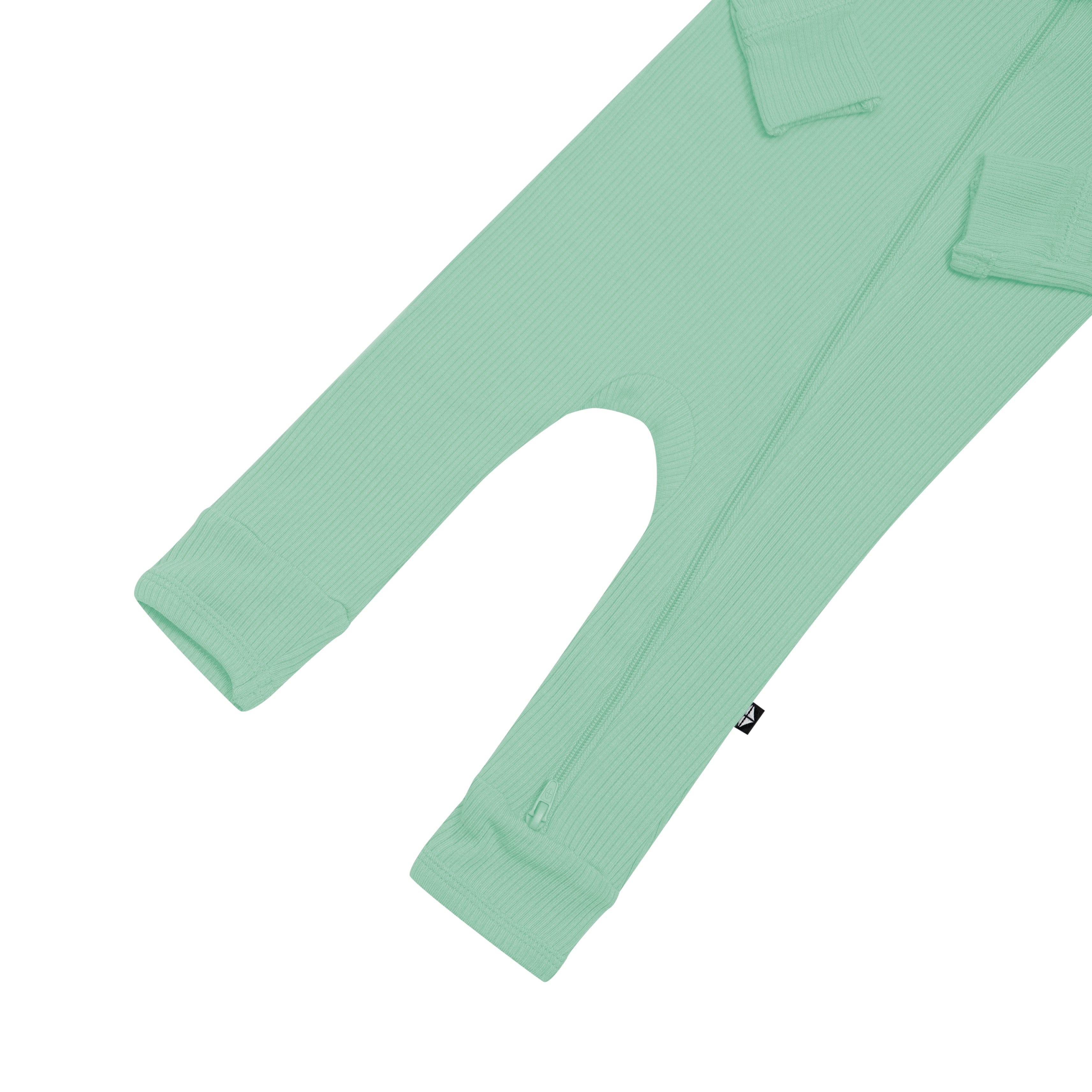 Open feet on Kyte Baby Ribbed Zippered Romper in Wasabi