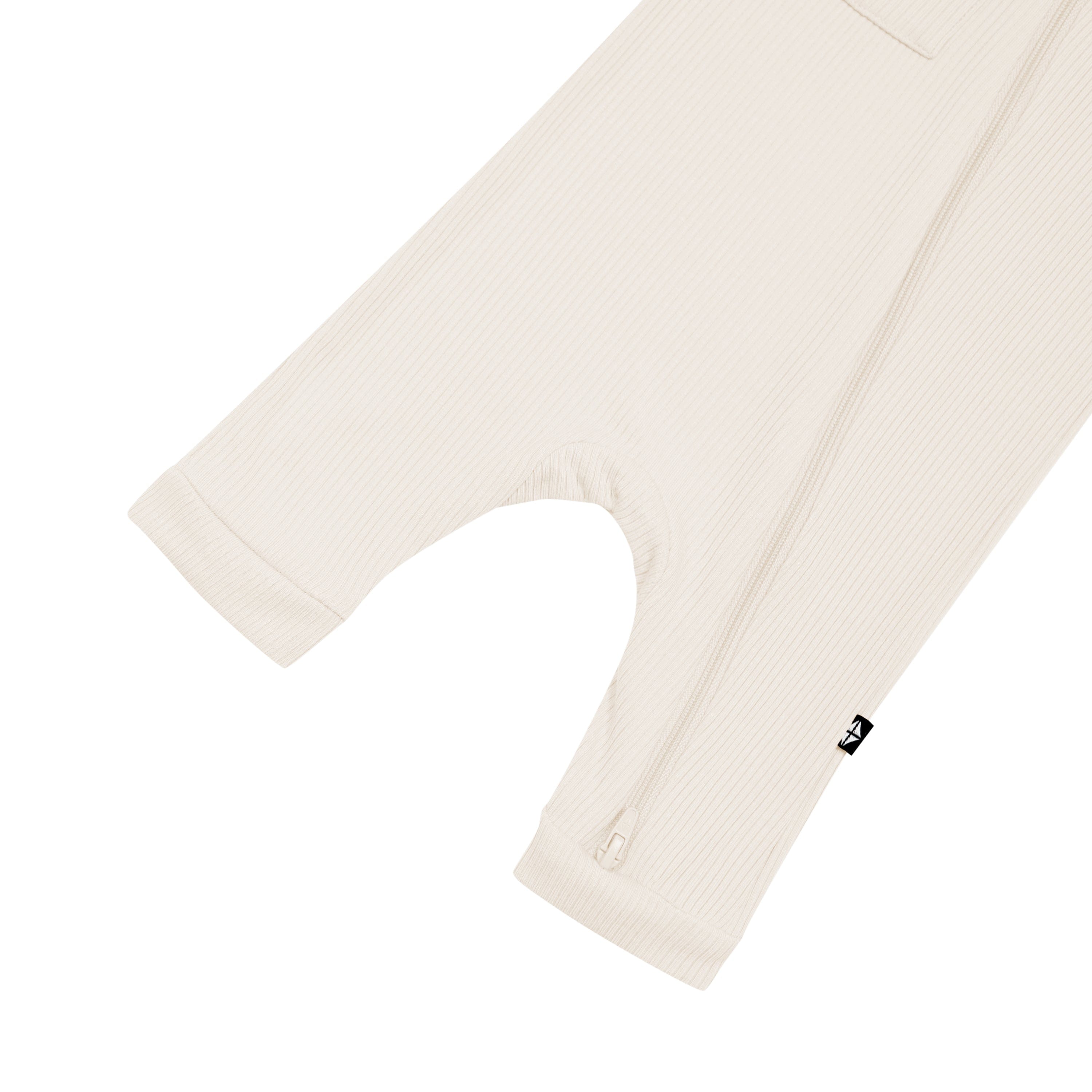 Double zipper on Kyte Baby Ribbed Zippered Sleeveless Romper in Oat
