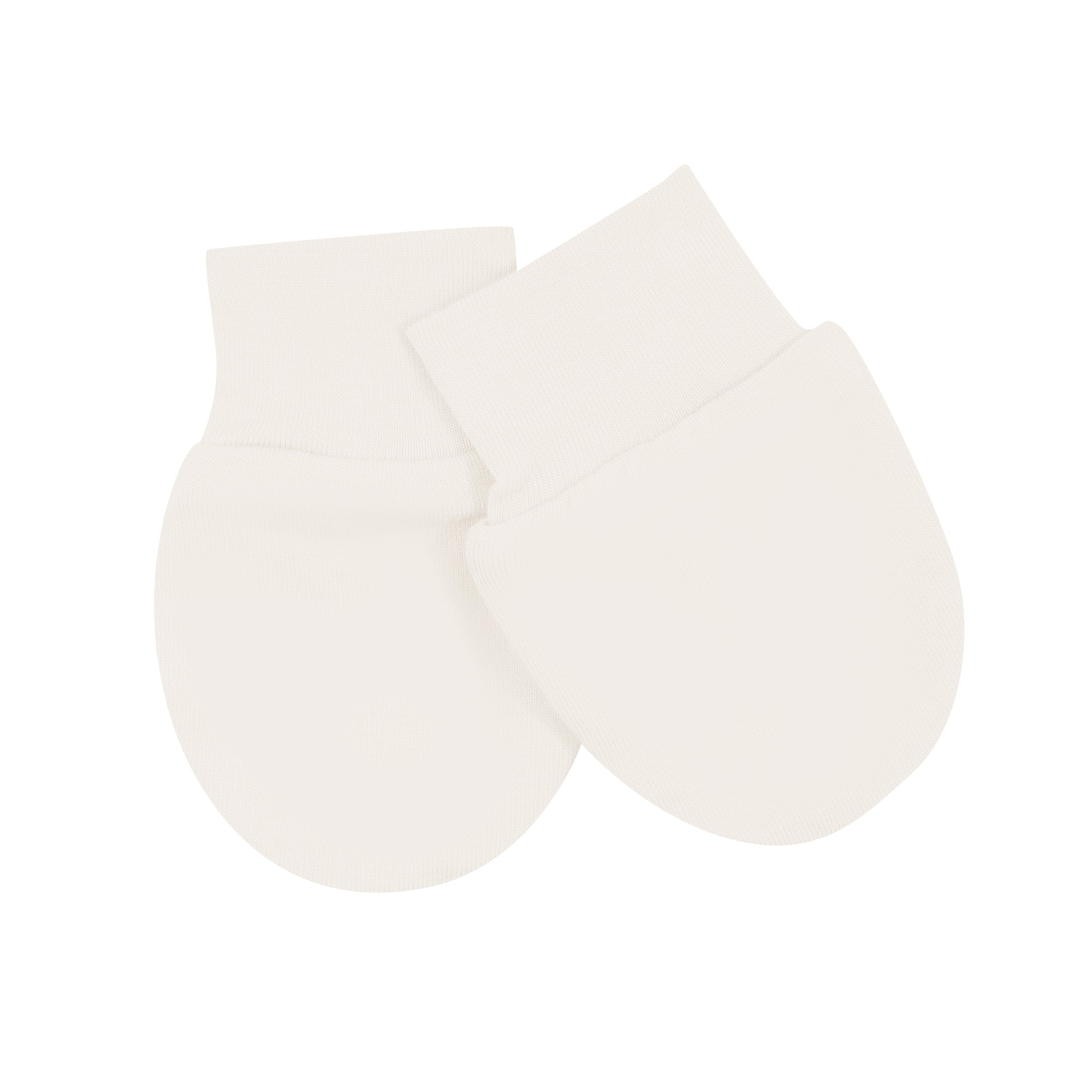 Flat lay of Kyte Baby Infant Scratch Mittens in Oat