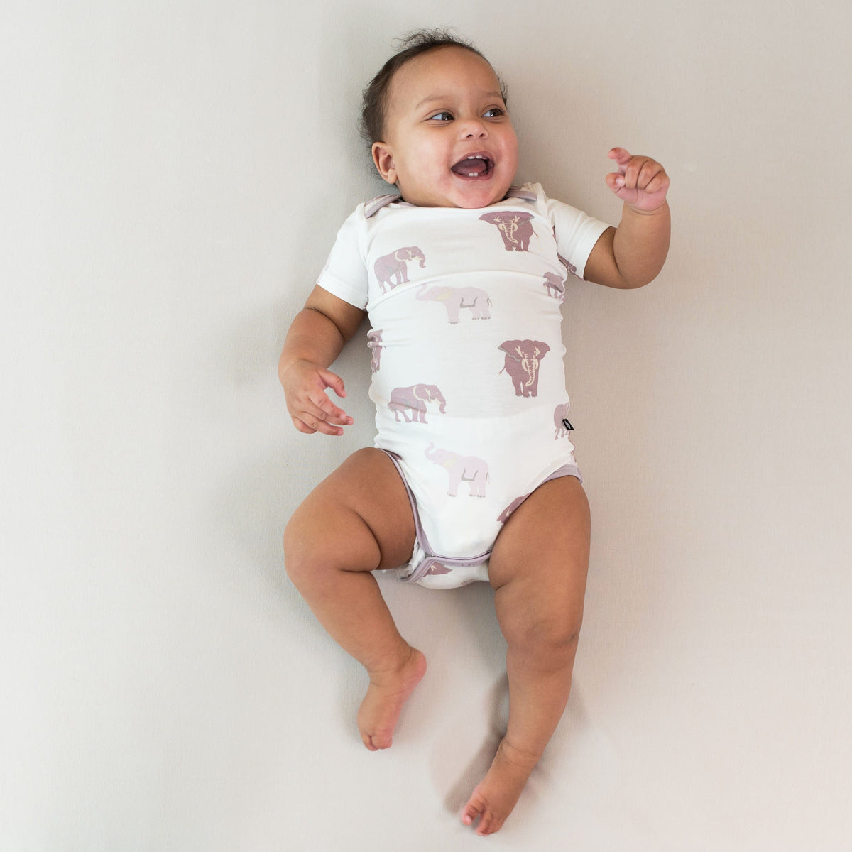 Baby wearing Kyte Baby infant Bodysuit in Elephant
