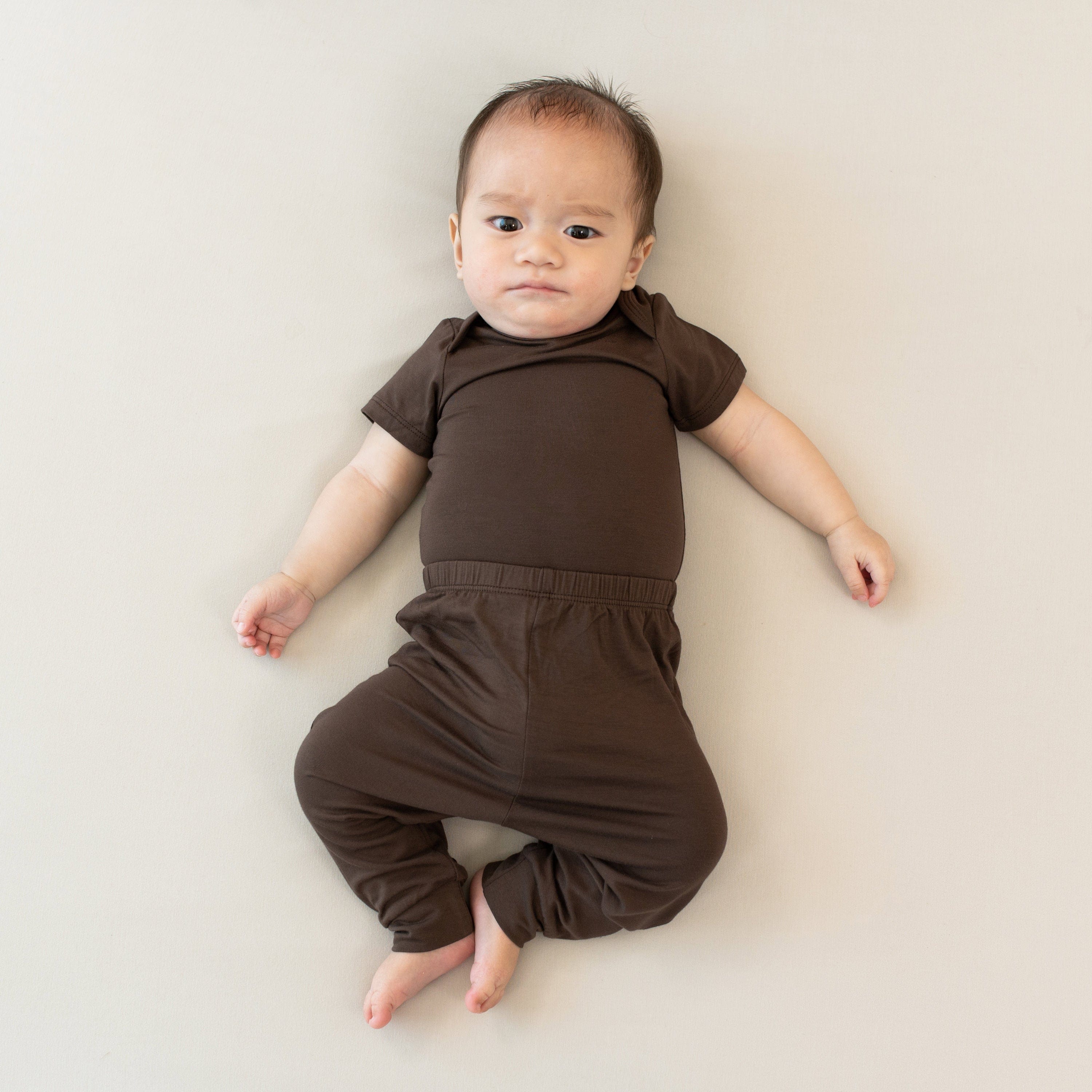 Infant wearing the Bodysuit in Espresso paired with matching pants