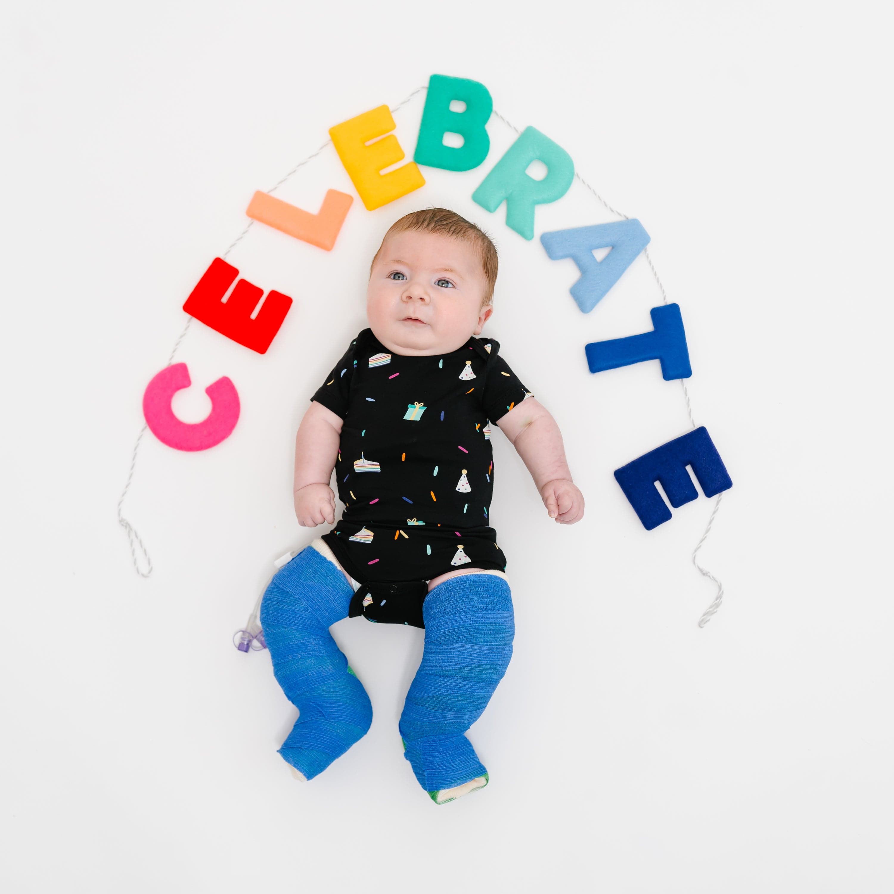 Kyte Baby Short Sleeve Bodysuits Bodysuit in Midnight Party
