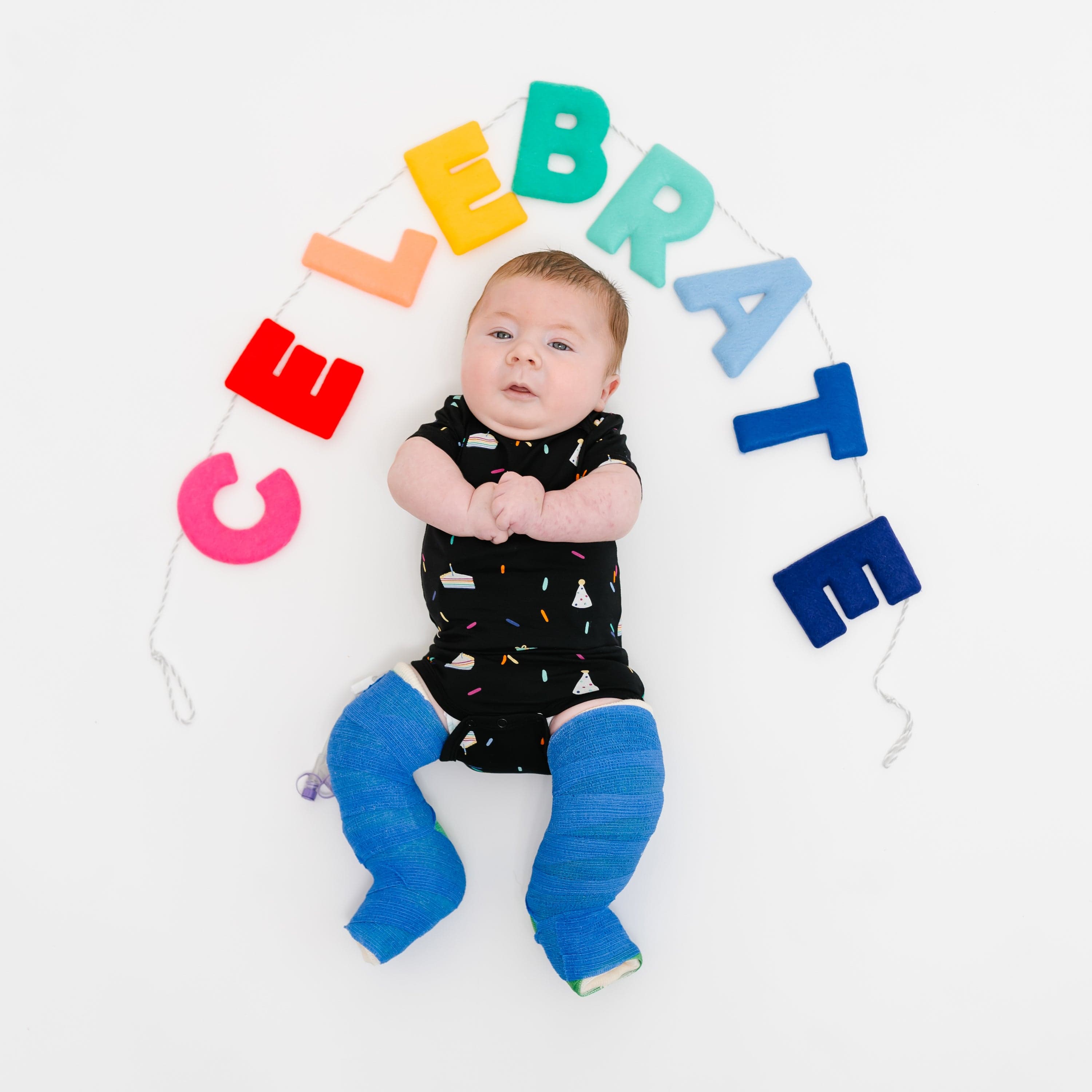 Kyte Baby Short Sleeve Bodysuits Bodysuit in Midnight Party