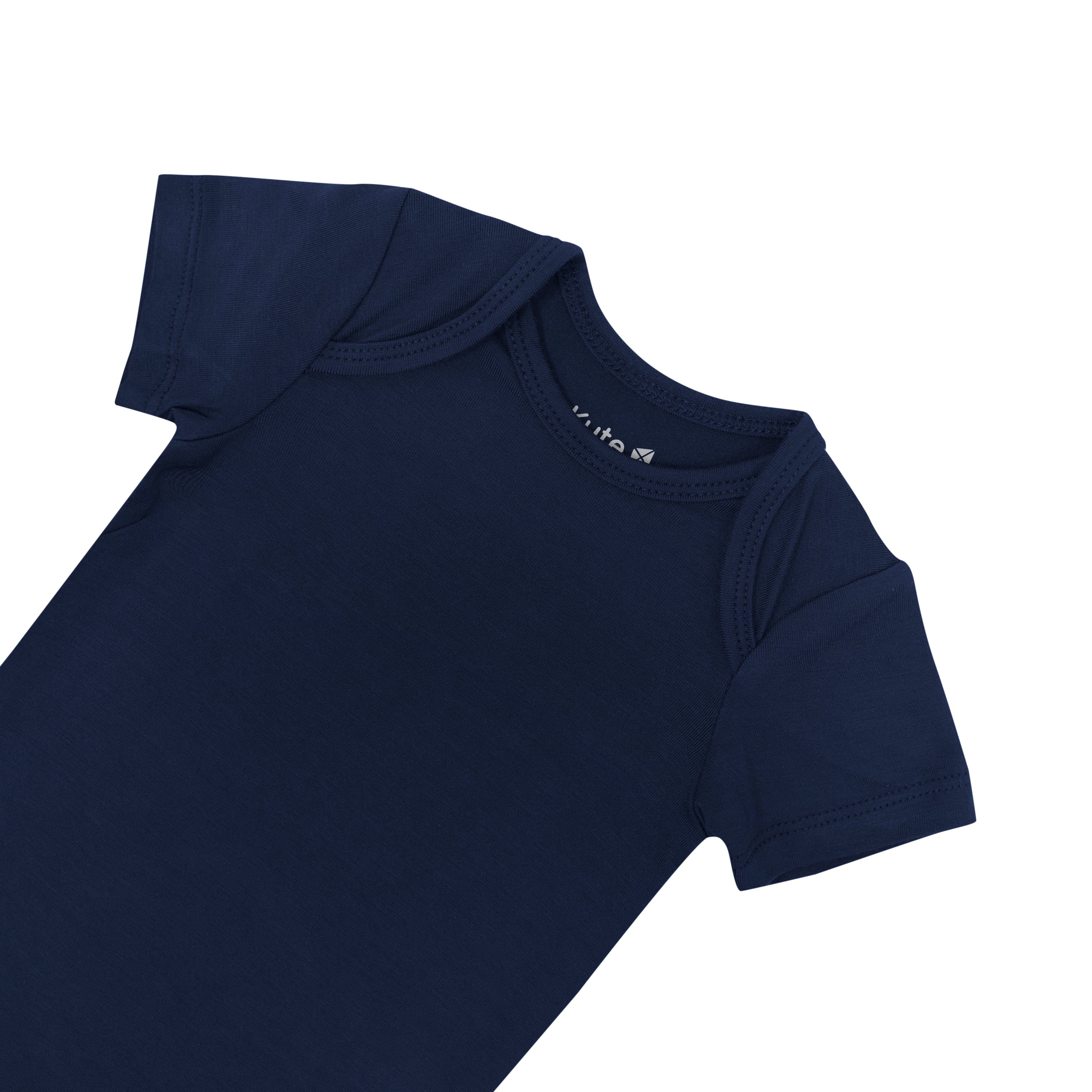 Close up of chest area of the Kyte Baby Short Sleeve Bodysuits Bodysuit in Navy