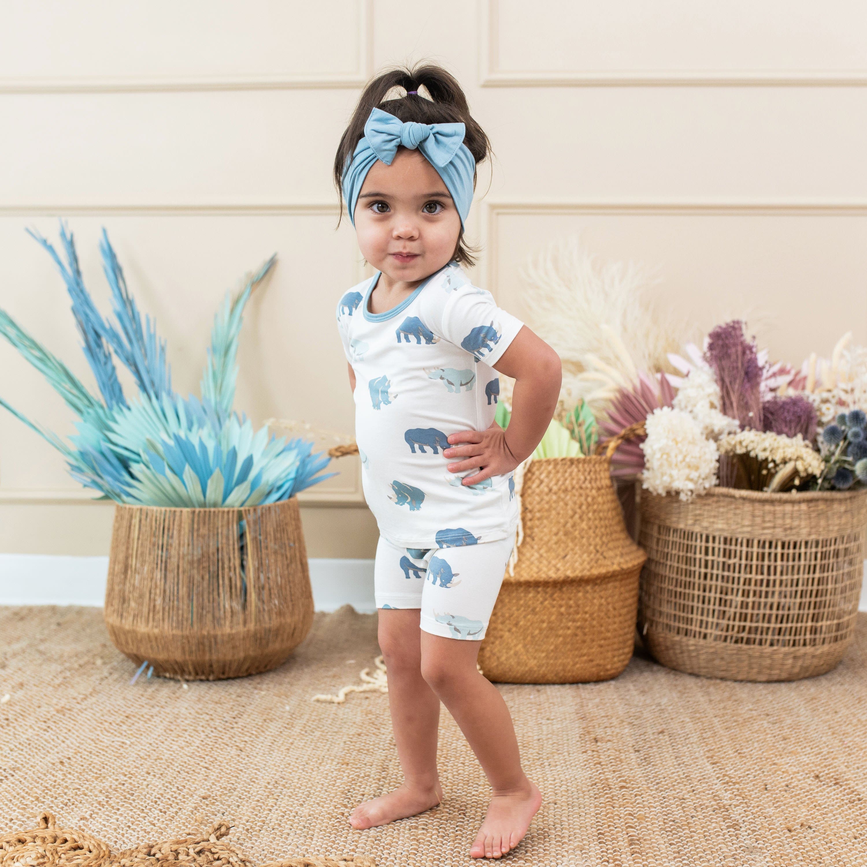 Toddler wearing Kyte Baby Short Sleeve Pajamas in Rhino