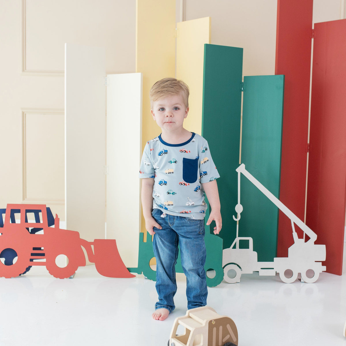 Boy wearing Kyte Baby Toddler Crew Neck Tee in Construction
