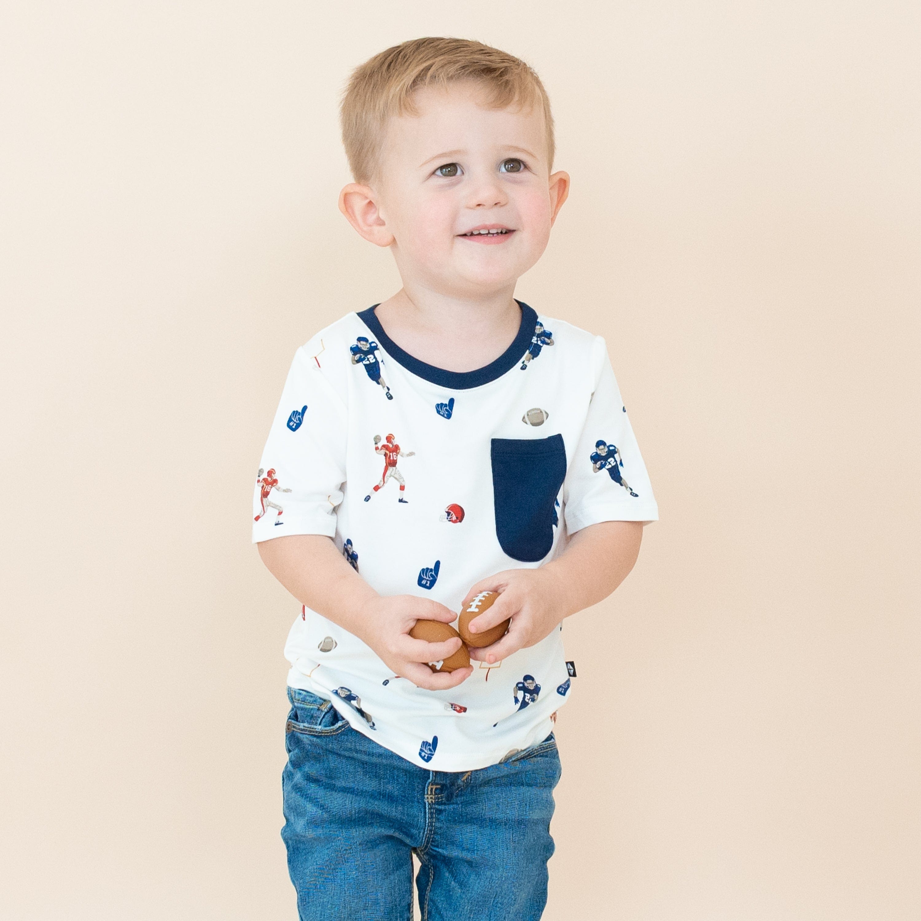Boy wearing Kyte Baby Toddler Crew Neck Tee in Football